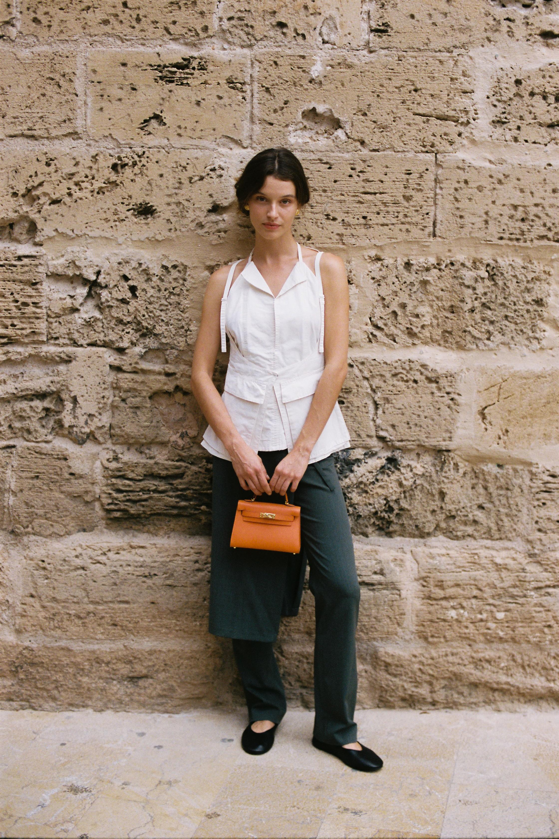 Grey straight-leg pants with integrated mini skirt detail