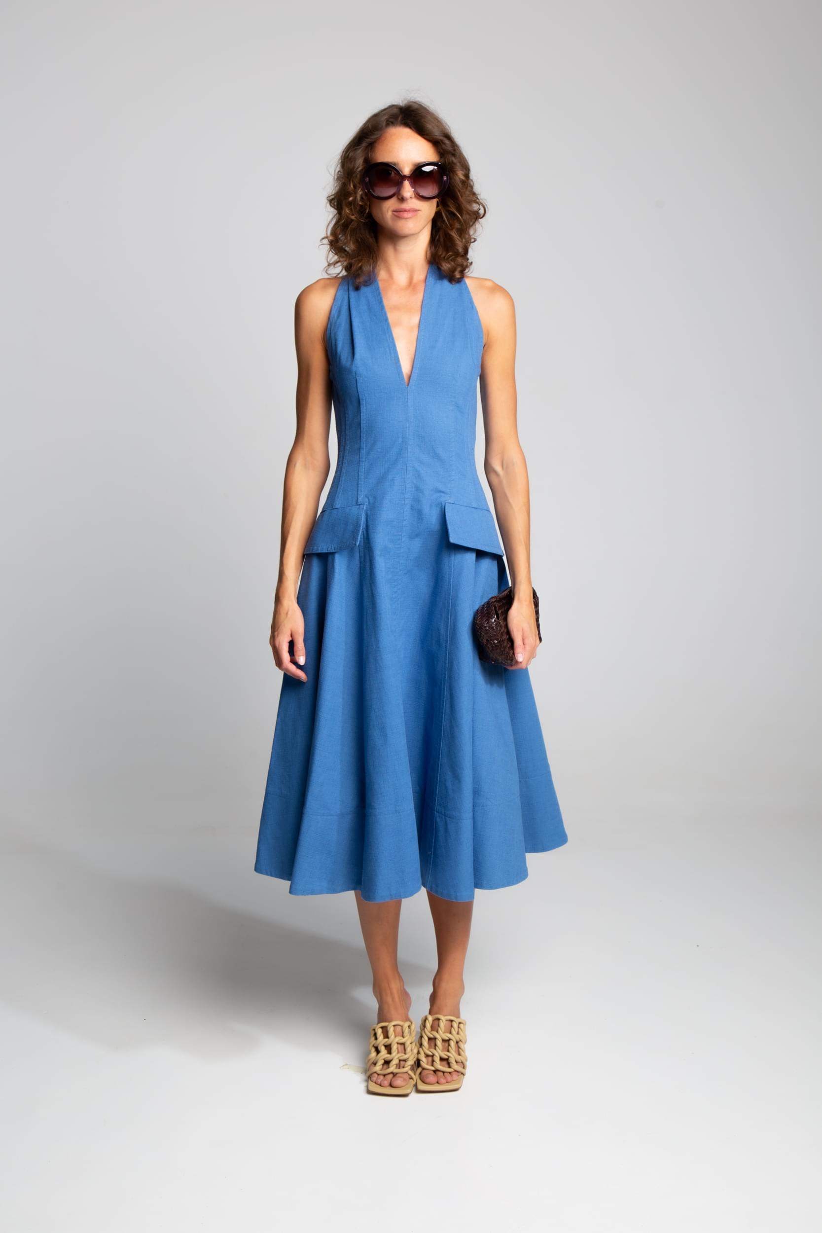 Vibrant blue midi dress with plunging neckline and structured cotton fabric