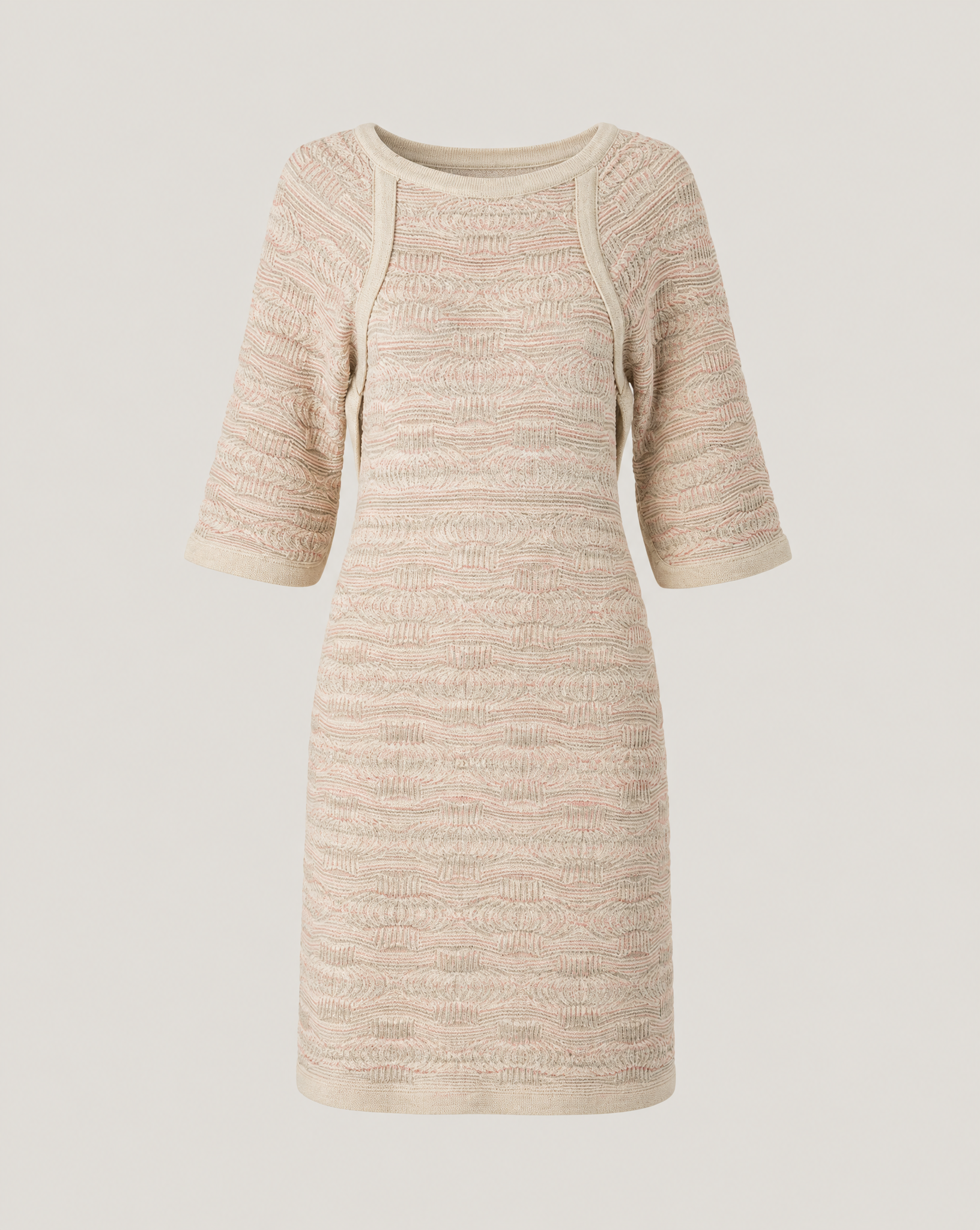 Close-up of the Chanel Dubai Tweed knit dress highlighting the intricate 3D architectural weave and tonal desert-inspired color palette.