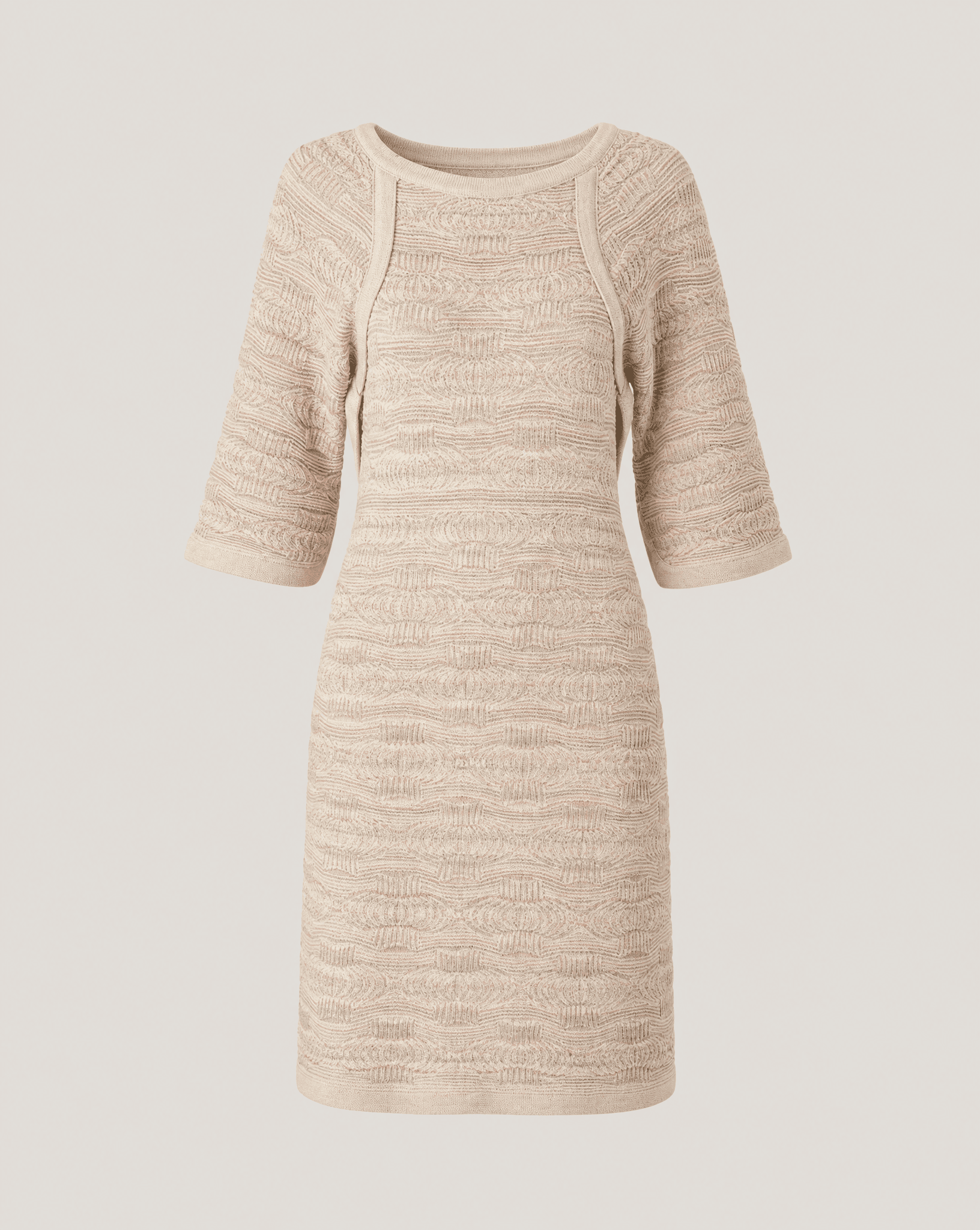 Close-up of the Chanel Dubai Tweed knit dress highlighting the intricate 3D architectural weave and tonal desert-inspired color palette.