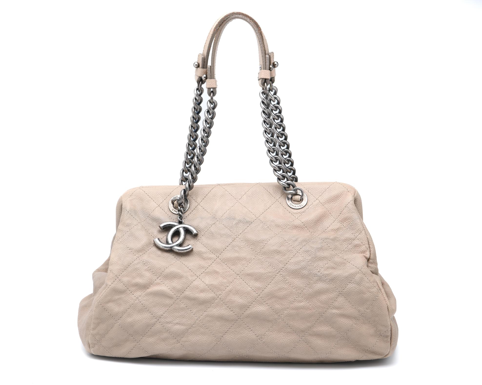Chanel quilted beige tote bag with double chain handles and slouch silhouette designer handbag