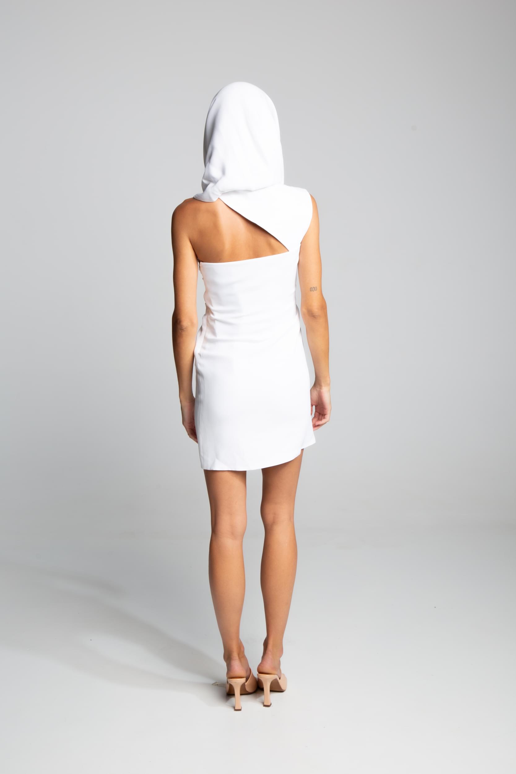 White sleeveless mini dress with oversized hood and minimalist silhouette