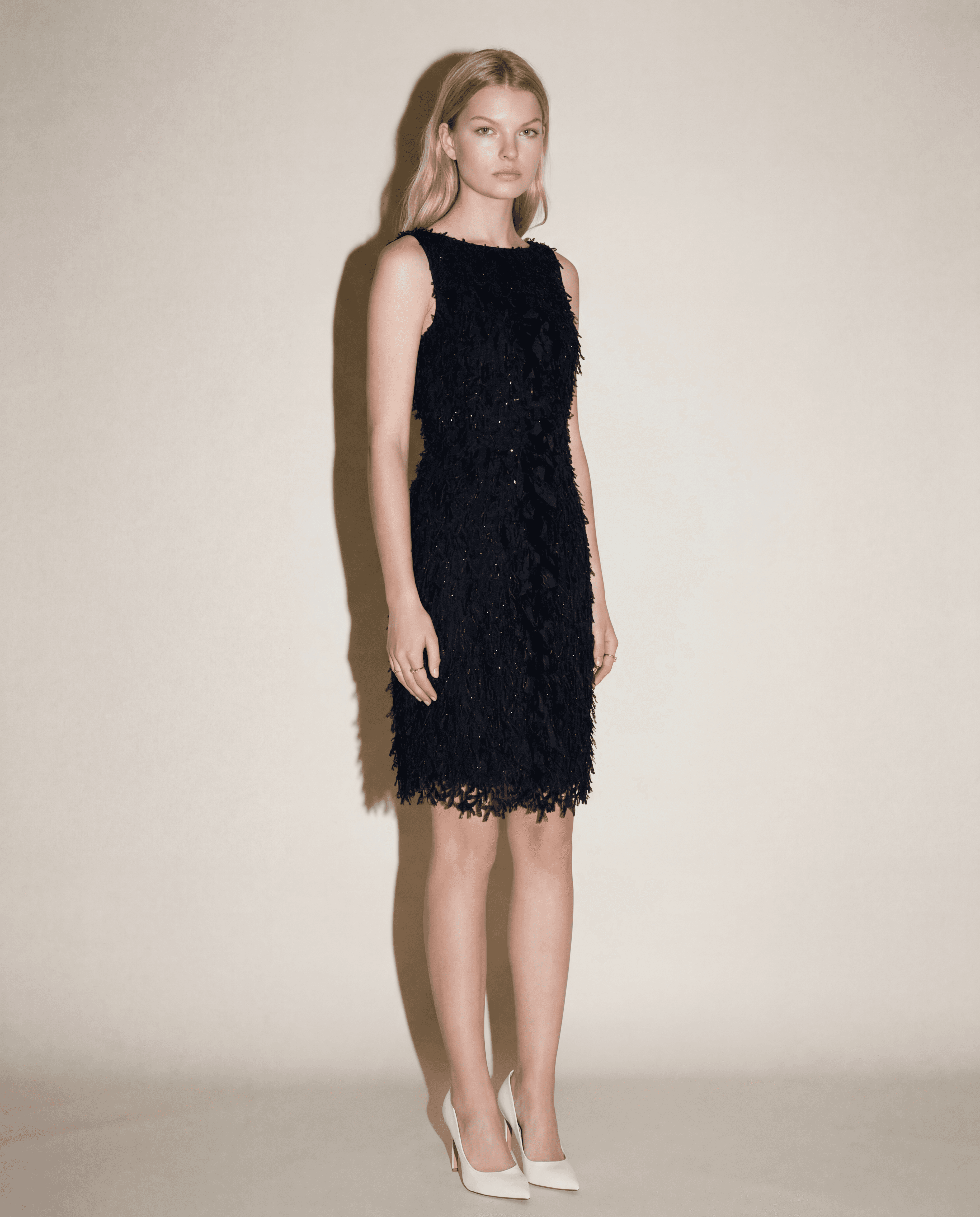 Oscar de la Renta evening dress with rich appliqué surface and elegant straight cut