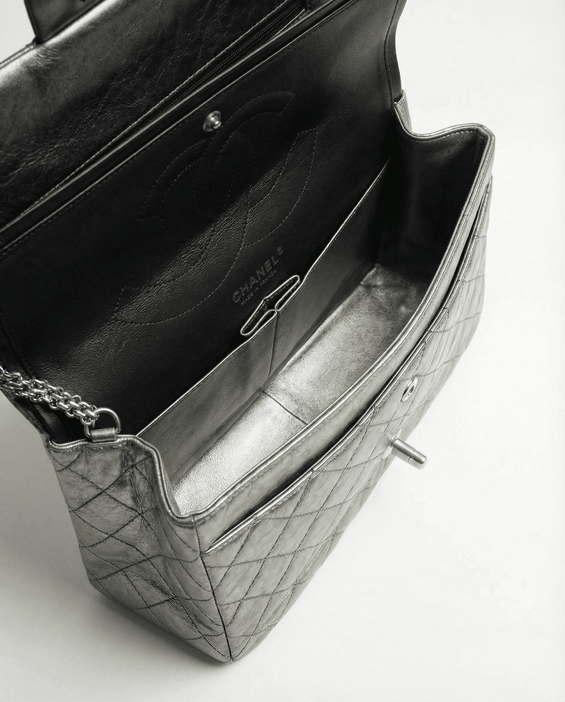 Chanel reissue bag with all metal chain strap and vintage crinkled leather