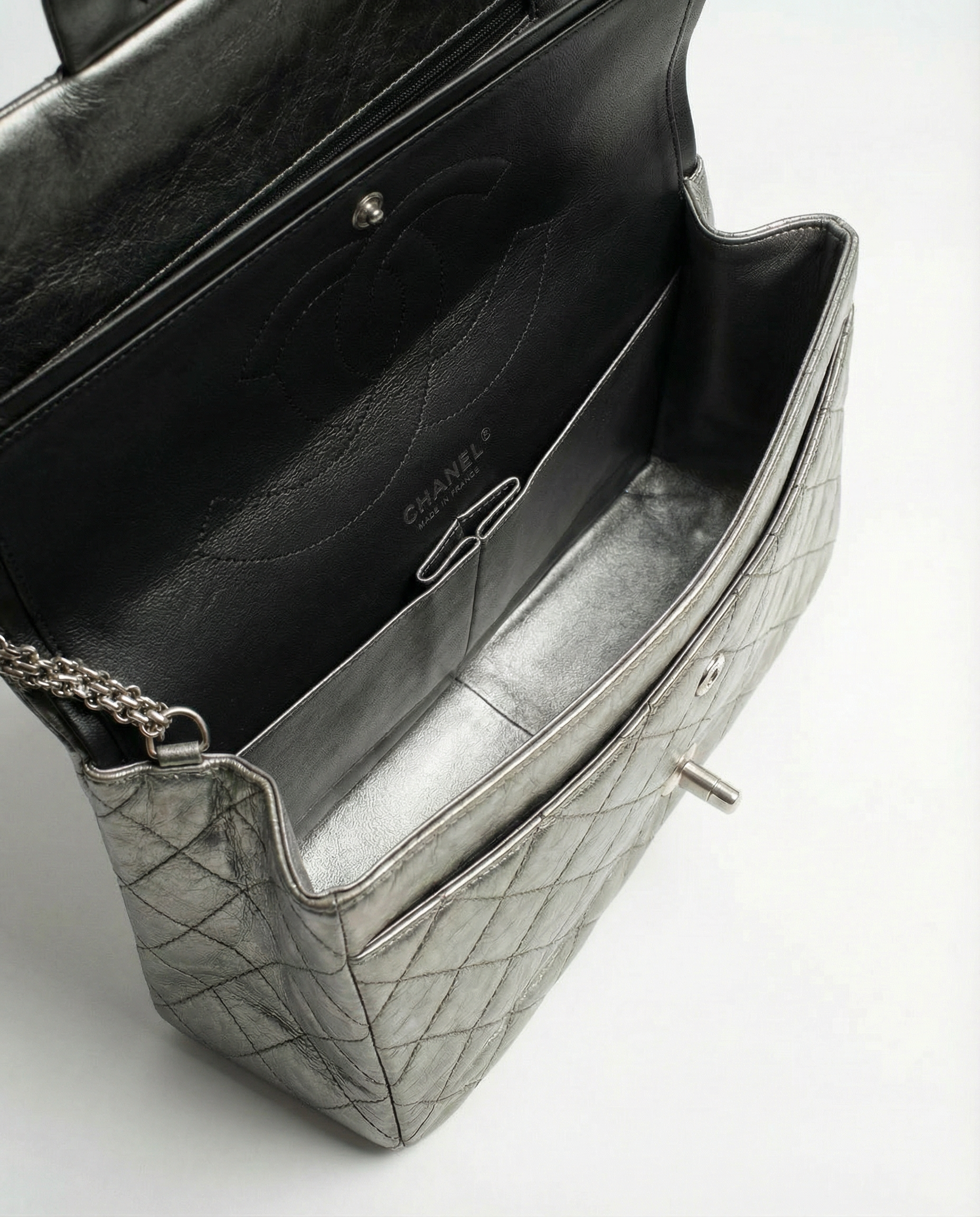 Chanel reissue bag with all metal chain strap and vintage crinkled leather