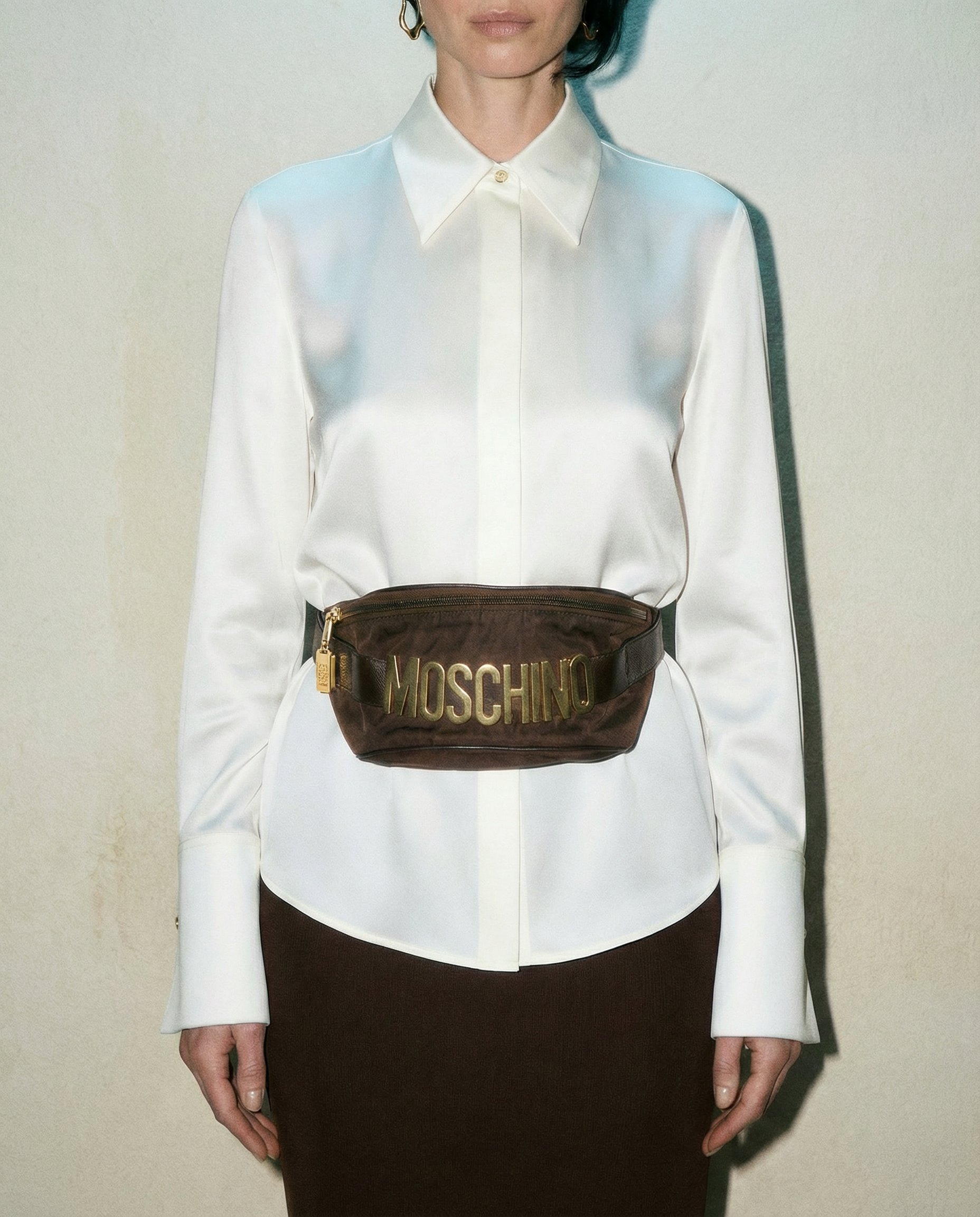 Moschino vintage 90s logo belt bag by Redwall styled on waist | luxury designer accessory Mezzanotte Madrid rental and sale