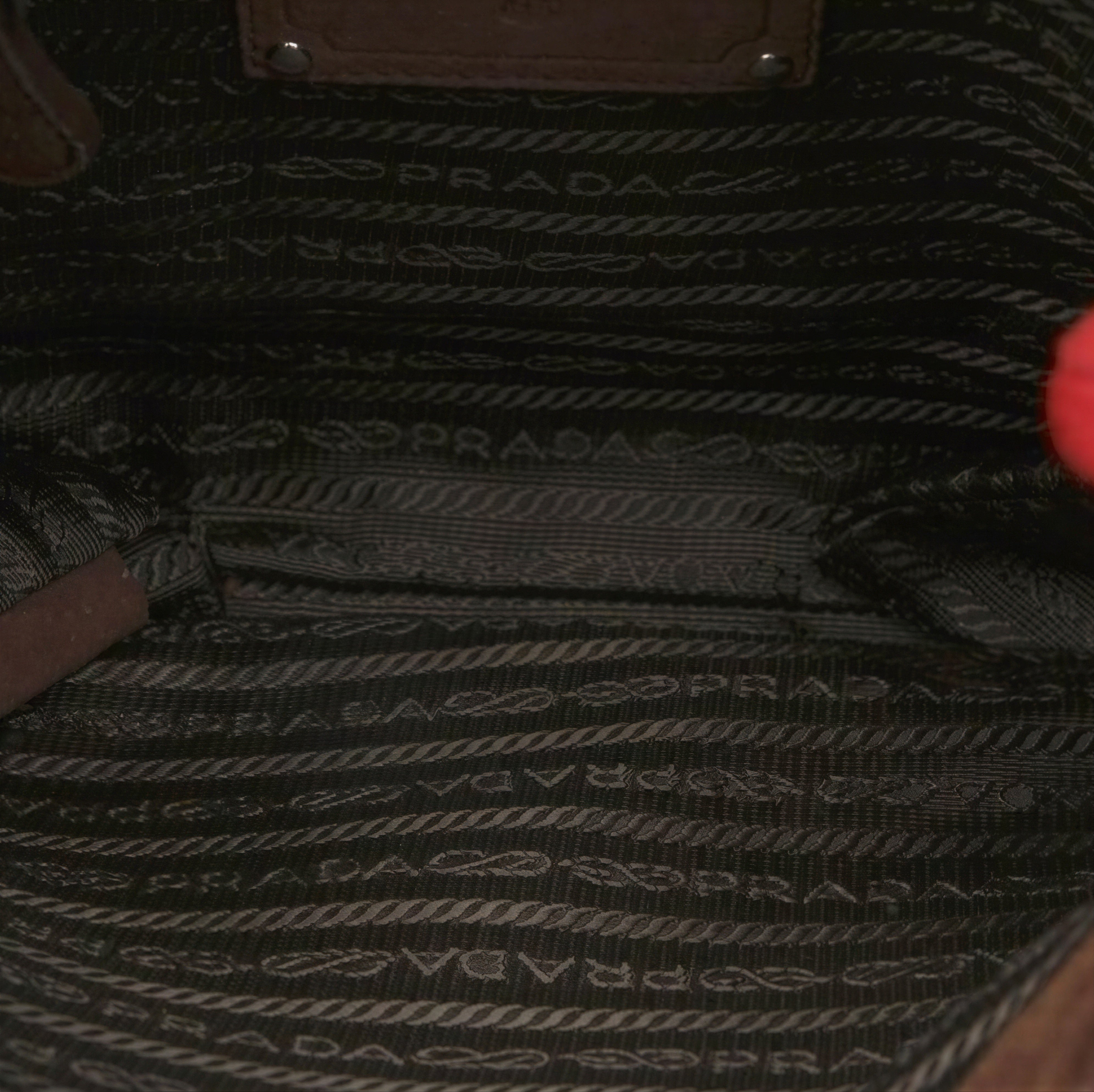 Suede Prada bag with sculptural shaggy handle design