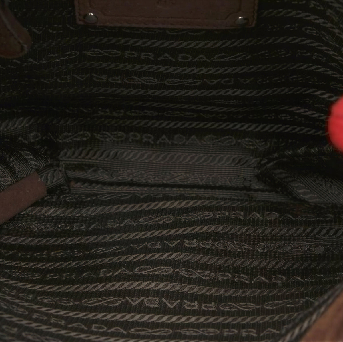 Suede Prada bag with sculptural shaggy handle design