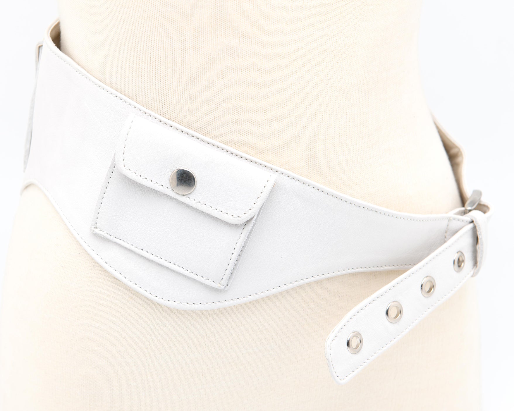 White leather utility belt with curved silhouette and snap button pockets Gimaguas designer accessory