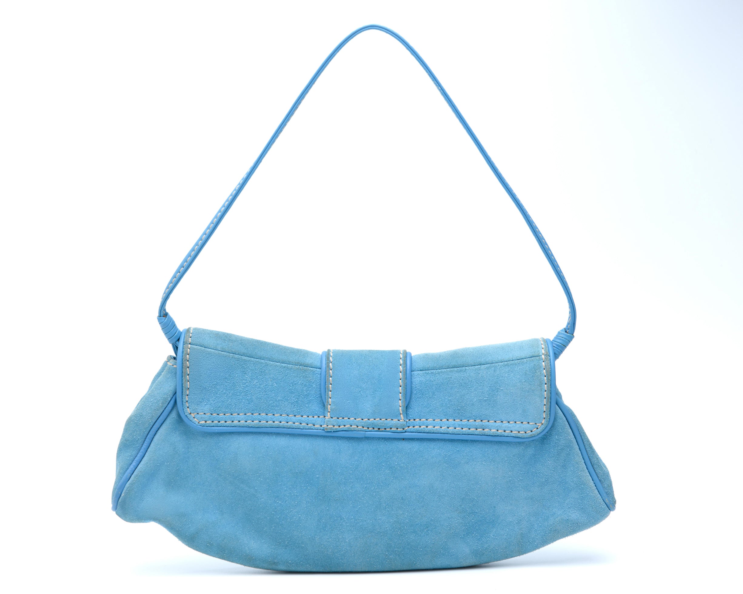 Light blue Celine vintage shoulder bag in suede with flap closure and buckle hardware | luxury resale and rental Madrid