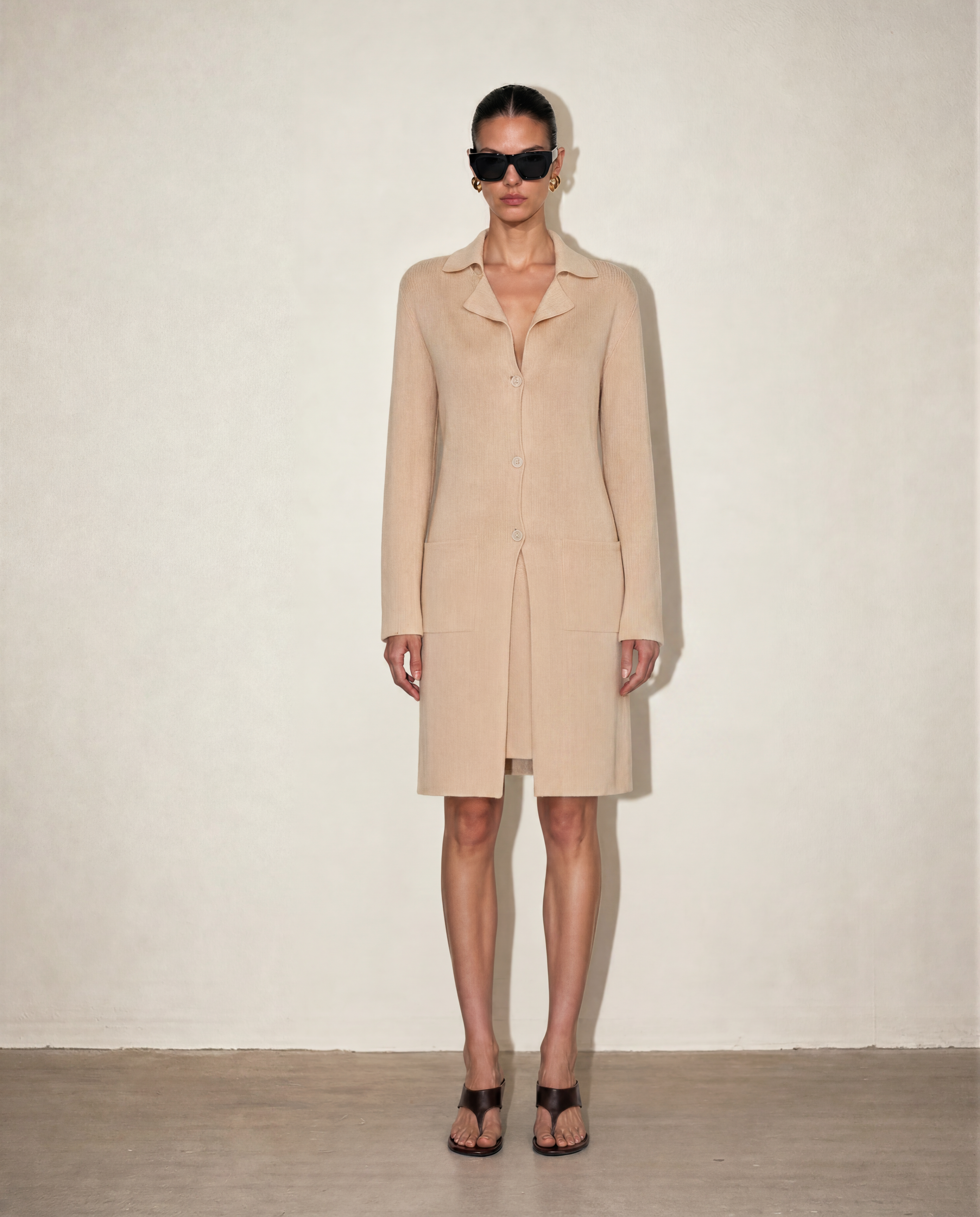 Front view of the Malo knit set featuring the silk-cotton V-neck slip dress and matching longline knit coat in a timeless nude beige.