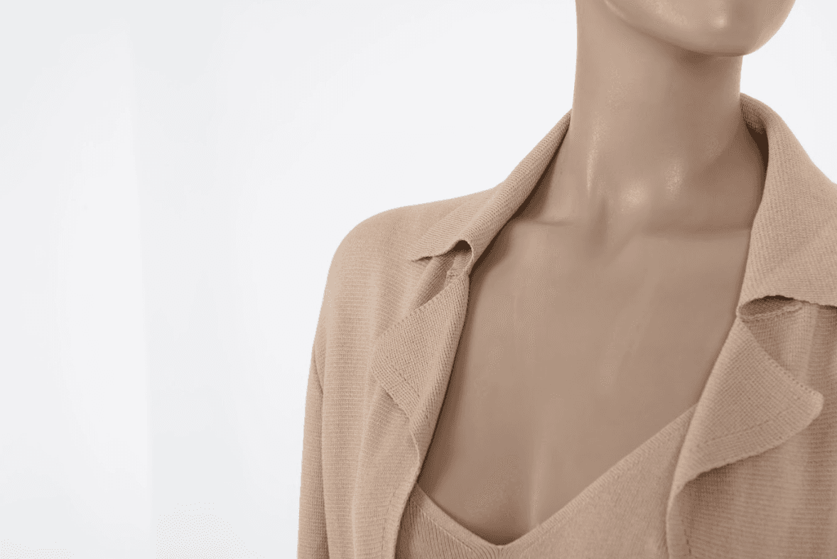 Close-up of the Malo knit set highlighting the intricate vertical wave-knit texture and the luxurious sheen of the silk-blend fabric.