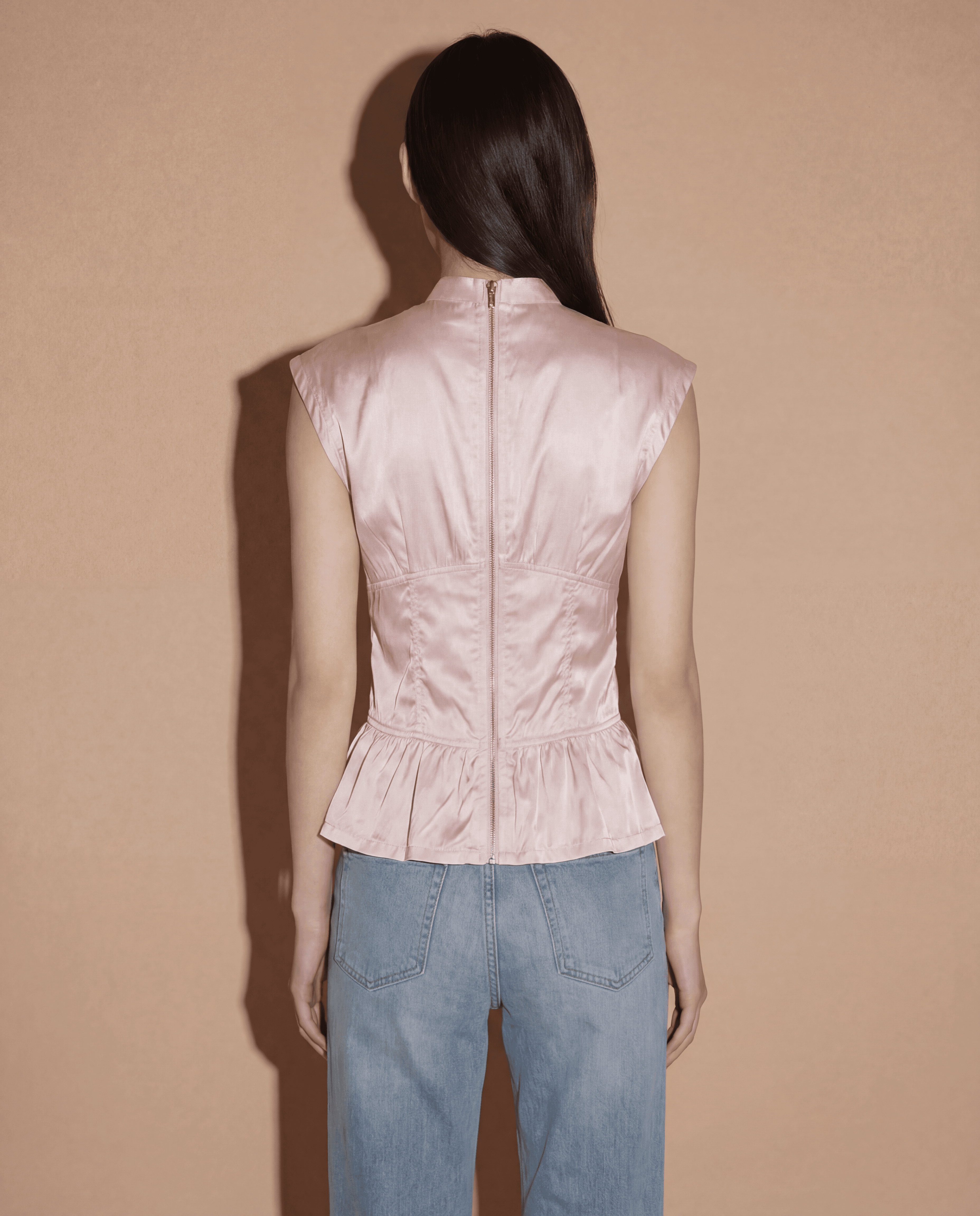 Back view of the Prada Sport corset-style top highlighting the iconic lace-up detailing for an adjustable cinched waist.