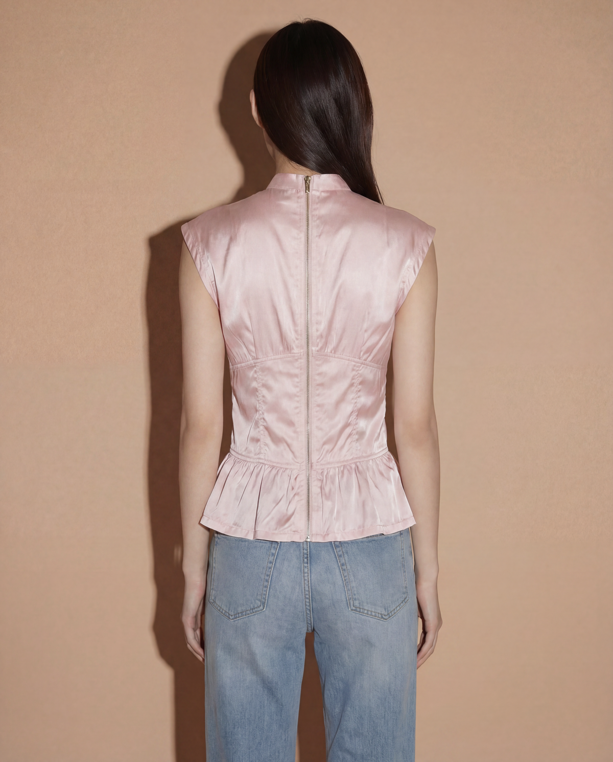 Back view of the Prada Sport corset-style top highlighting the iconic lace-up detailing for an adjustable cinched waist.