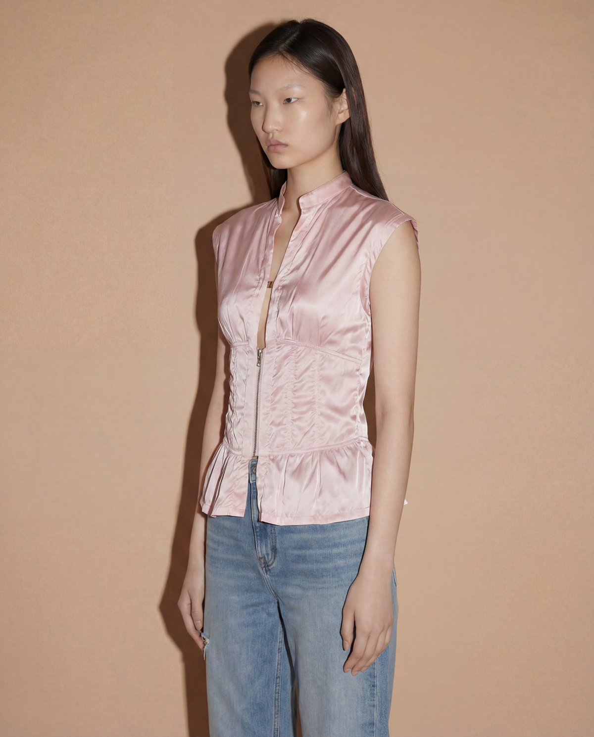 Side profile of the Prada Sport corset-style top showcasing the sculptural hourglass fit and industrial Linea Rossa design.