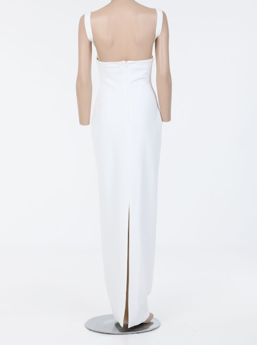 Minimalist white gown with wide straps and sculptural silhouette
