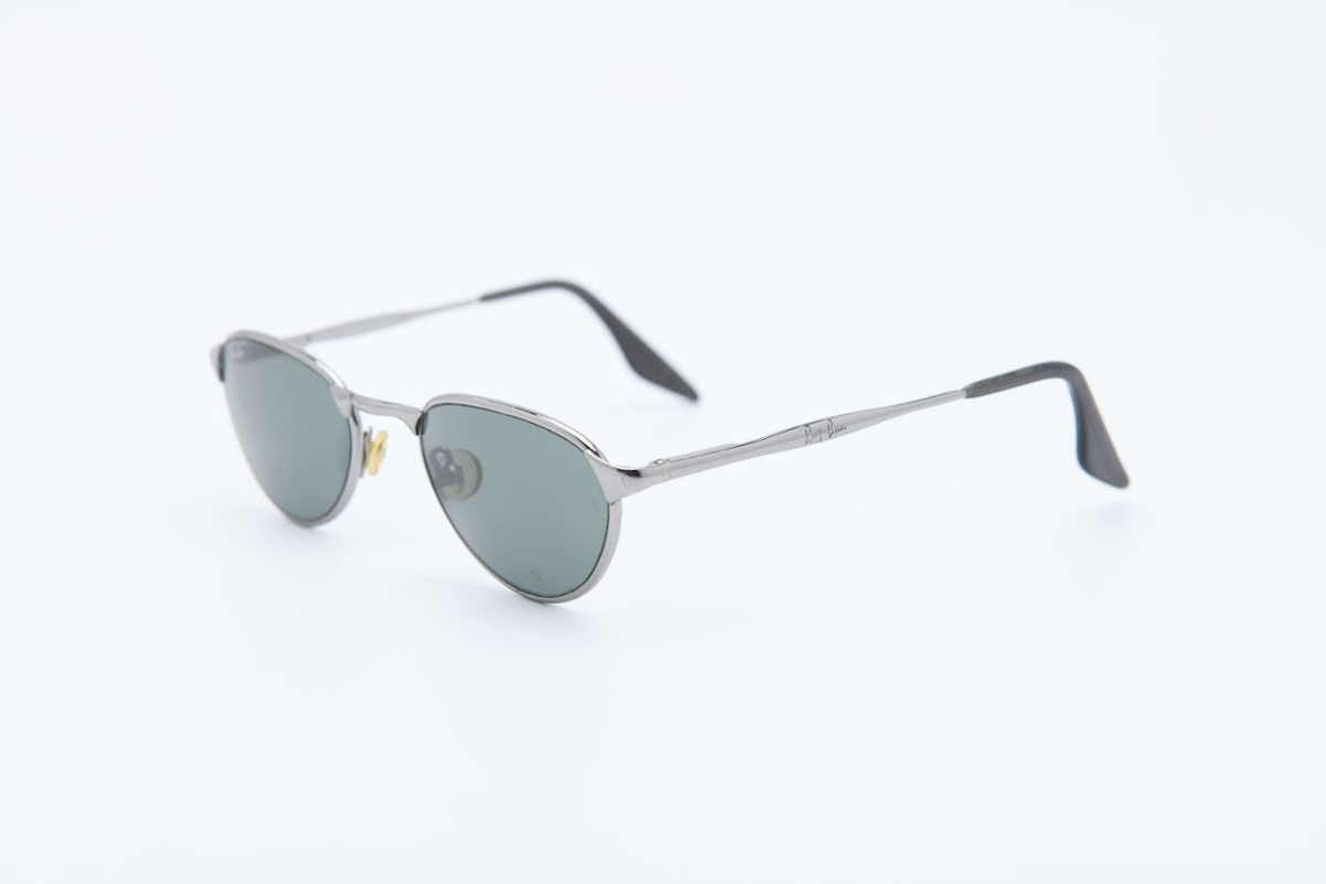 Vintage Ray-Ban oval sunglasses with slim metal frame and dark lenses | Bausch and Lomb model