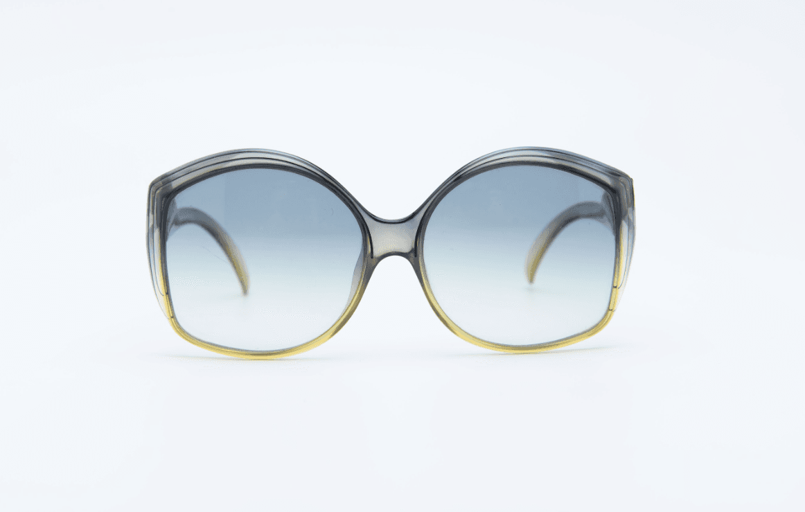 Vintage Dior 1970s sunglasses with large sculptural frame and tinted gradient lenses