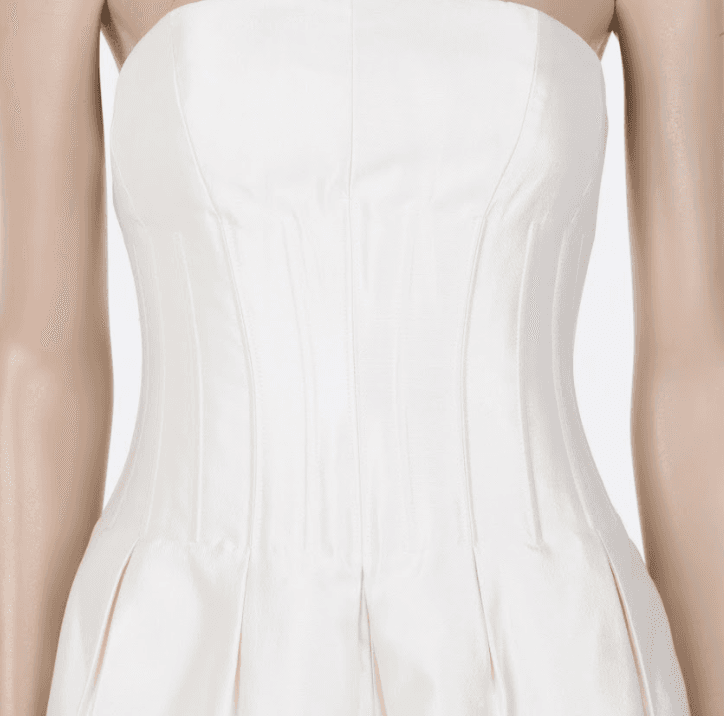Minimalist strapless corset dress with structured pleats and modern bridal aesthetic Mezzanotte Madrid