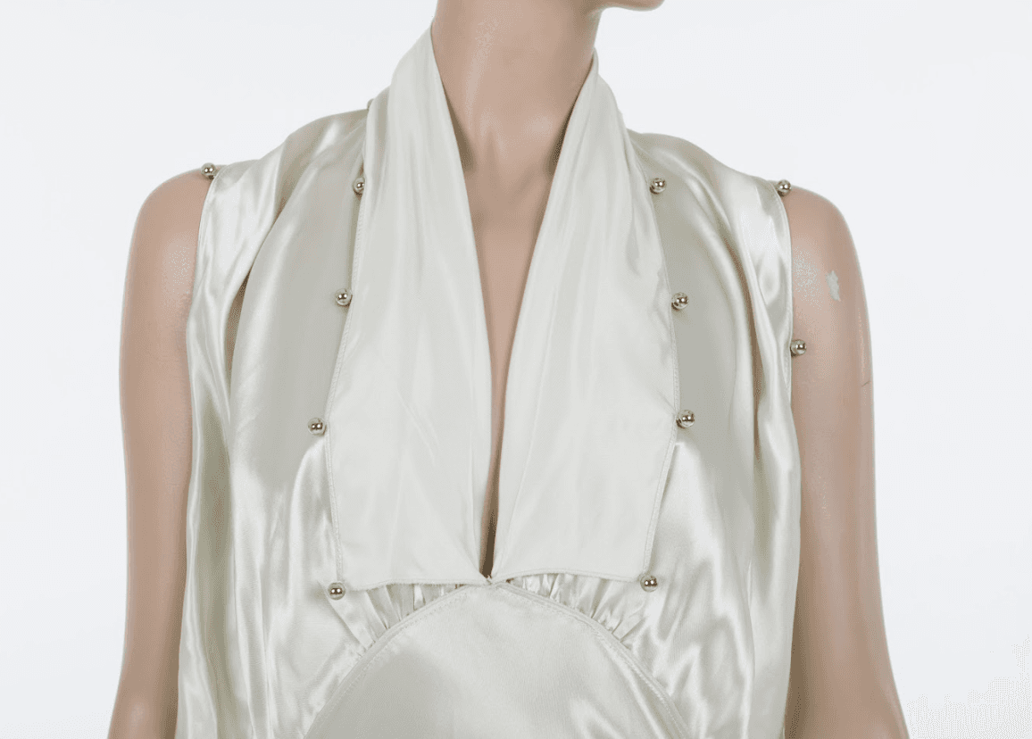 Light green midi dress with layered ruffles and minimalist luxury aesthetic
