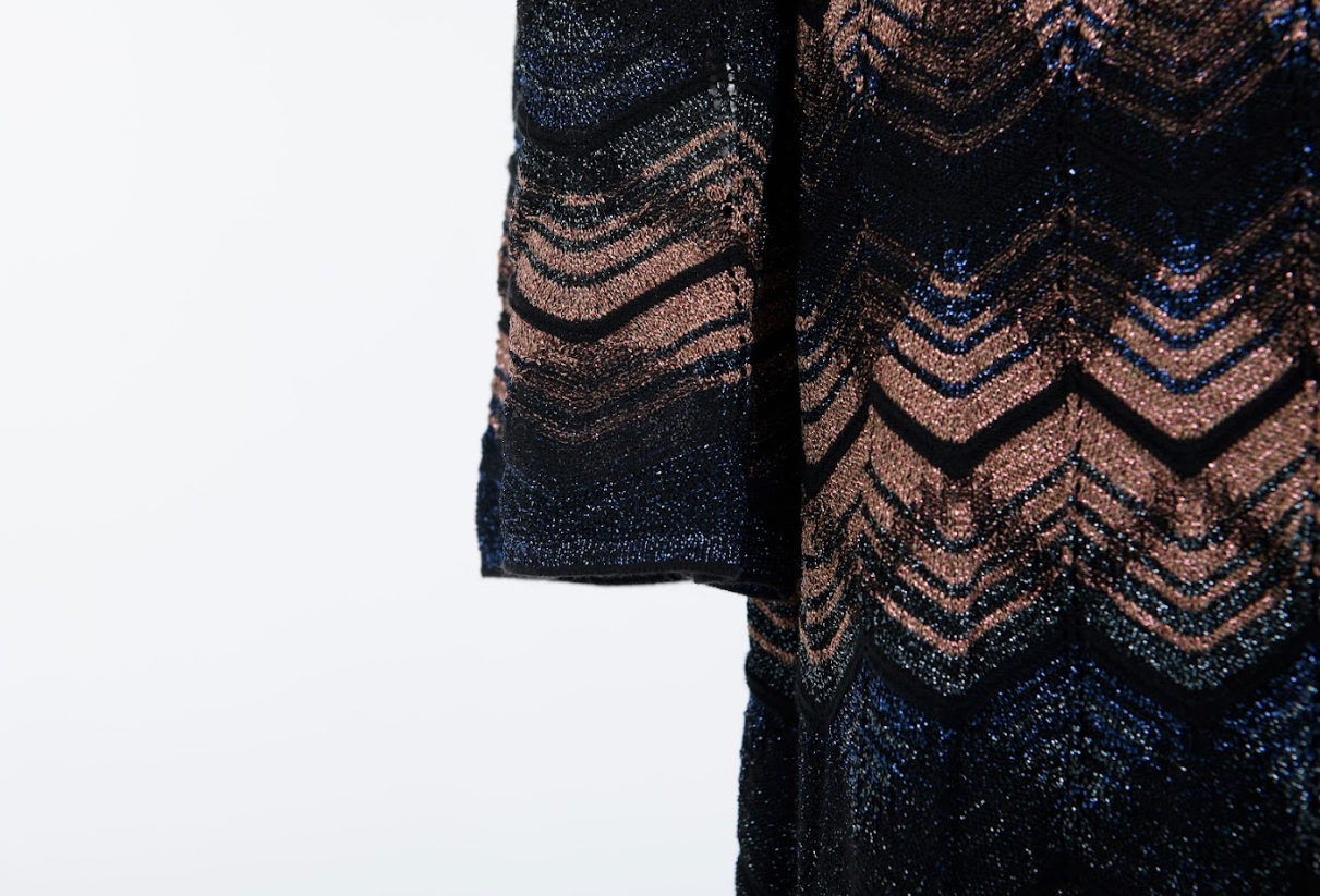 Designer knit dress with signature pattern and flowing silhouette