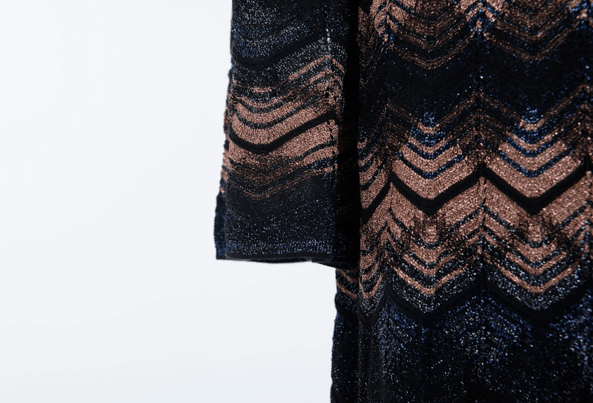 Designer knit dress with signature pattern and flowing silhouette
