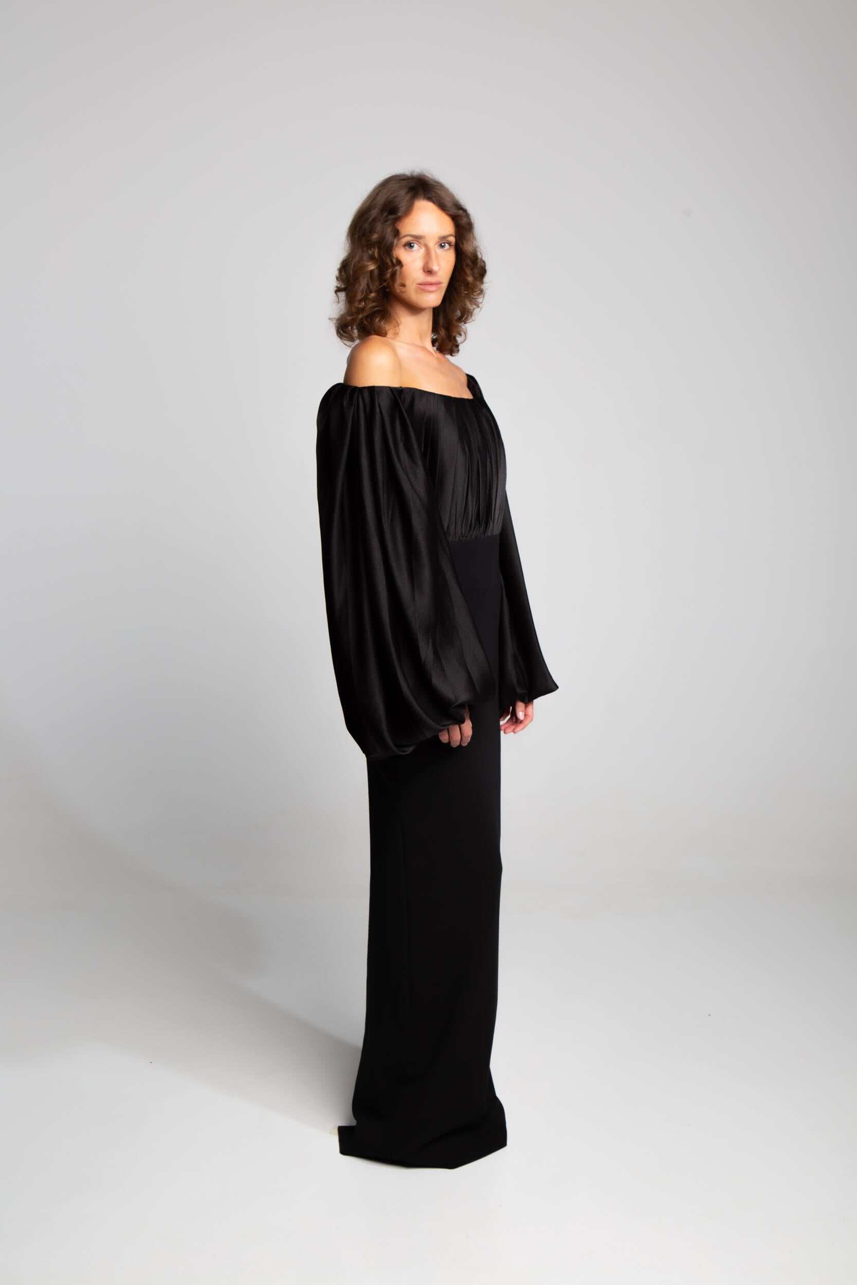 Black evening dress with dramatic sleeves and fitted column skirt elegant formalwear
