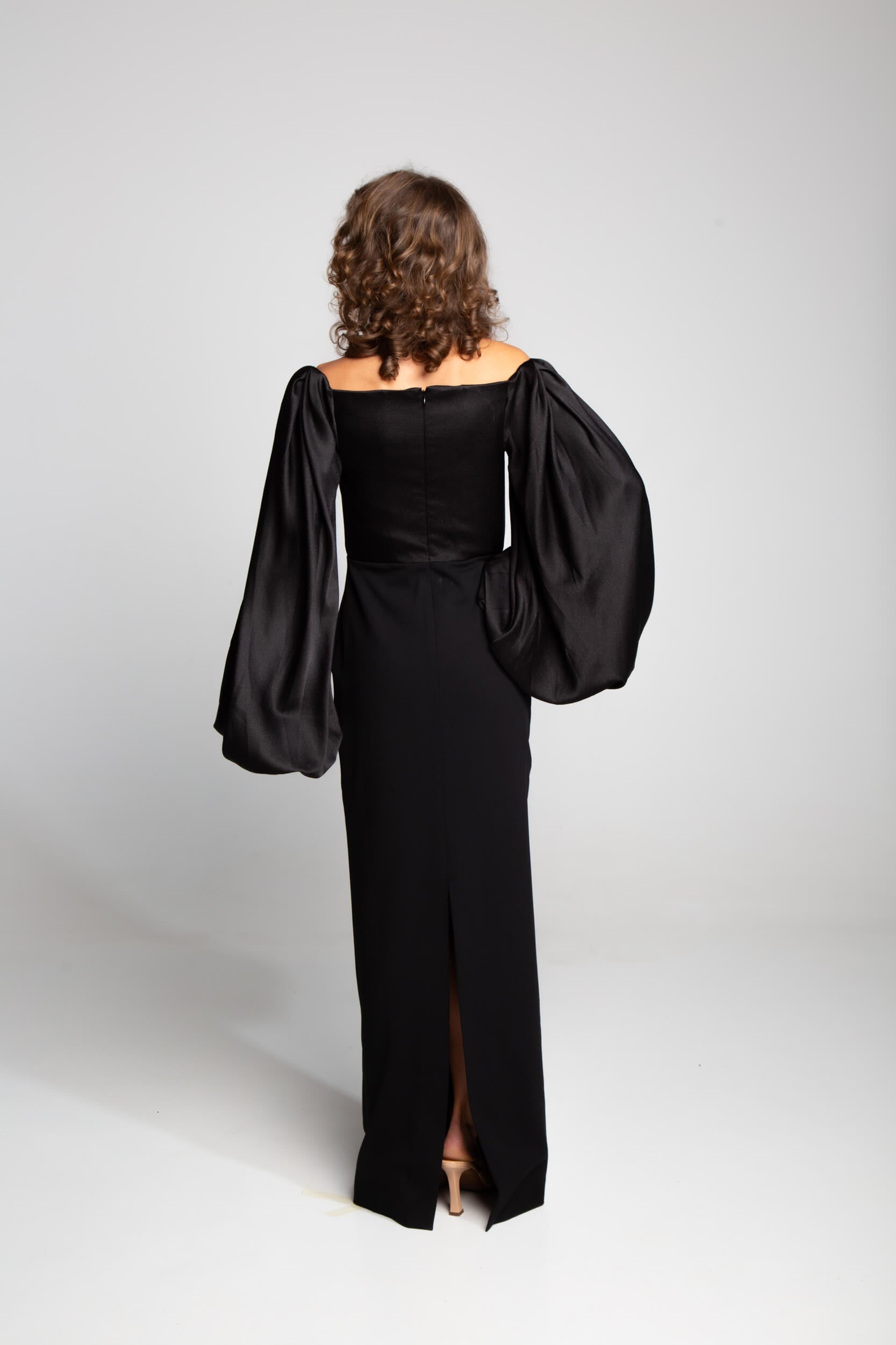 Solace London gown with wide neckline and flowing sleeves minimalist evening look Mezzanotte Madrid