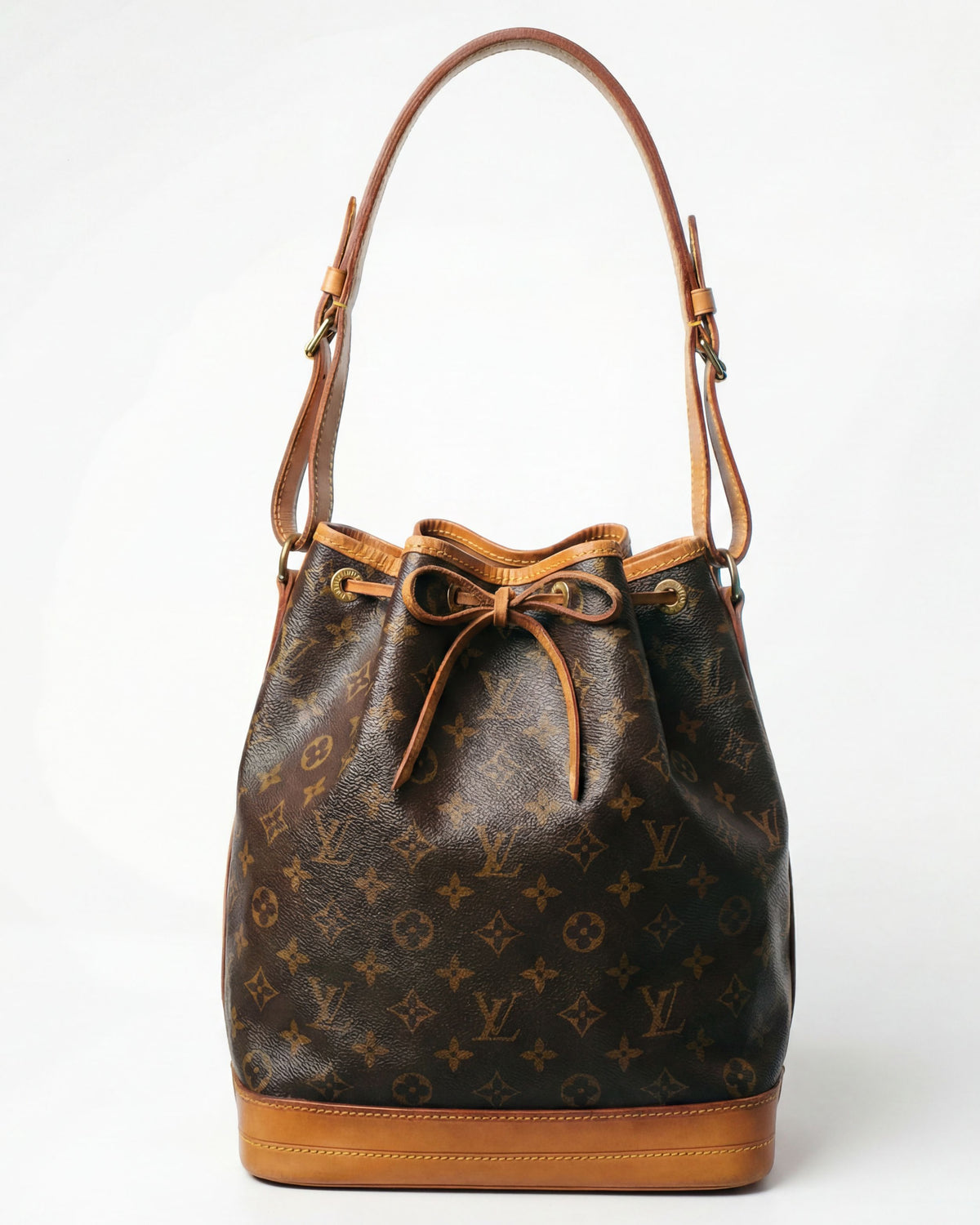 LV monogram drawstring bag with vachetta leather and bucket silhouette