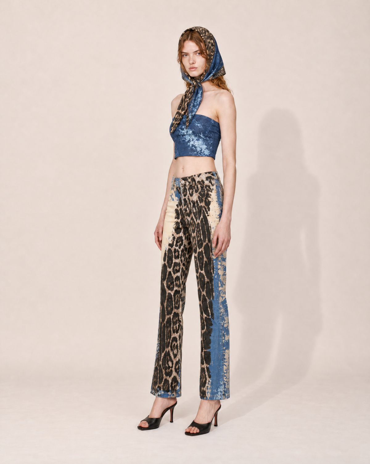 Early 2000s Roberto Cavalli palazzo trousers with a high waist, fluid wide legs and the distinctive Angels print. A rare Y2K designer piece for Cavalli collectors and vintage fashion lovers.