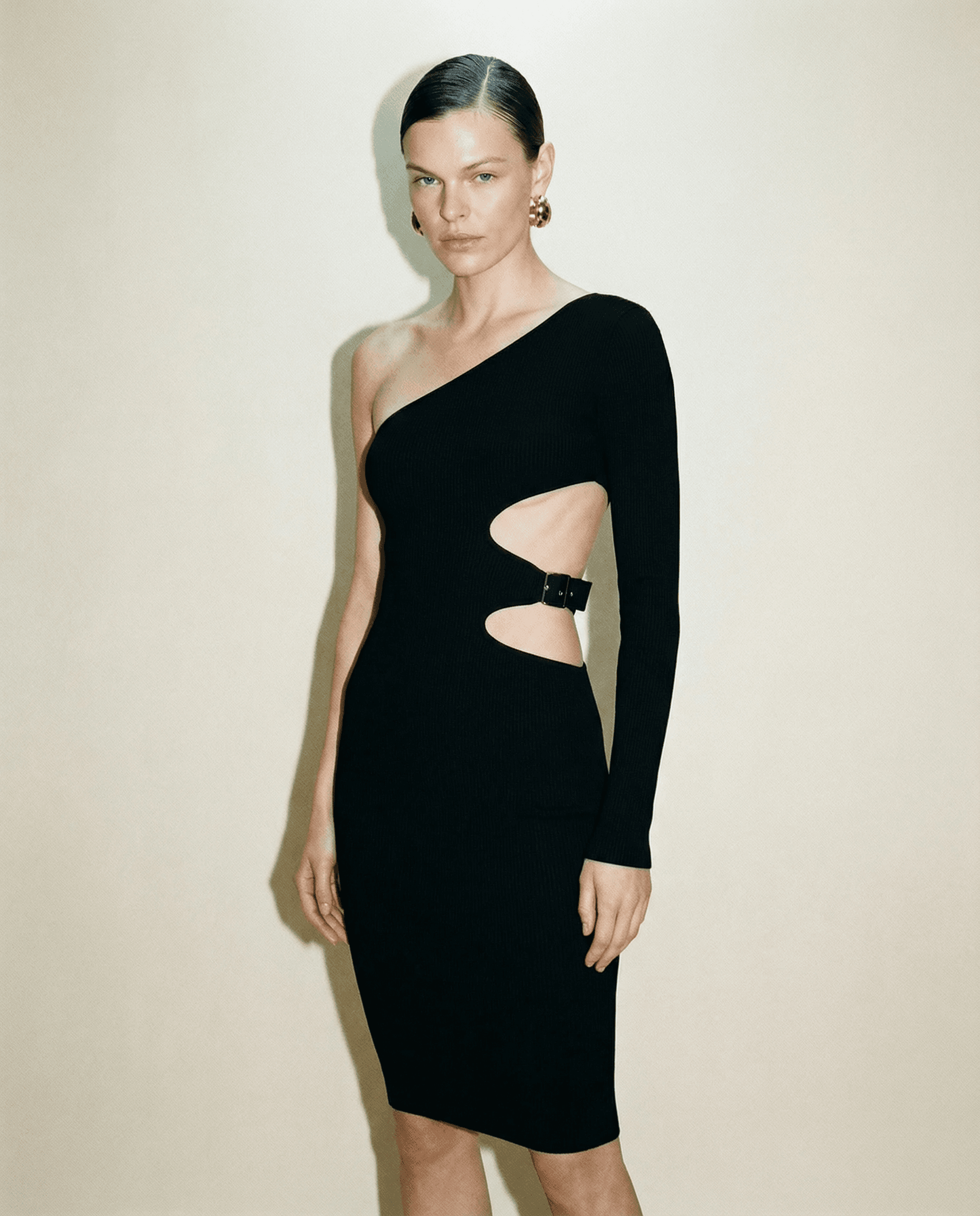 Vintage Tom Ford gown with asymmetric sleeve and cut-out waist detail