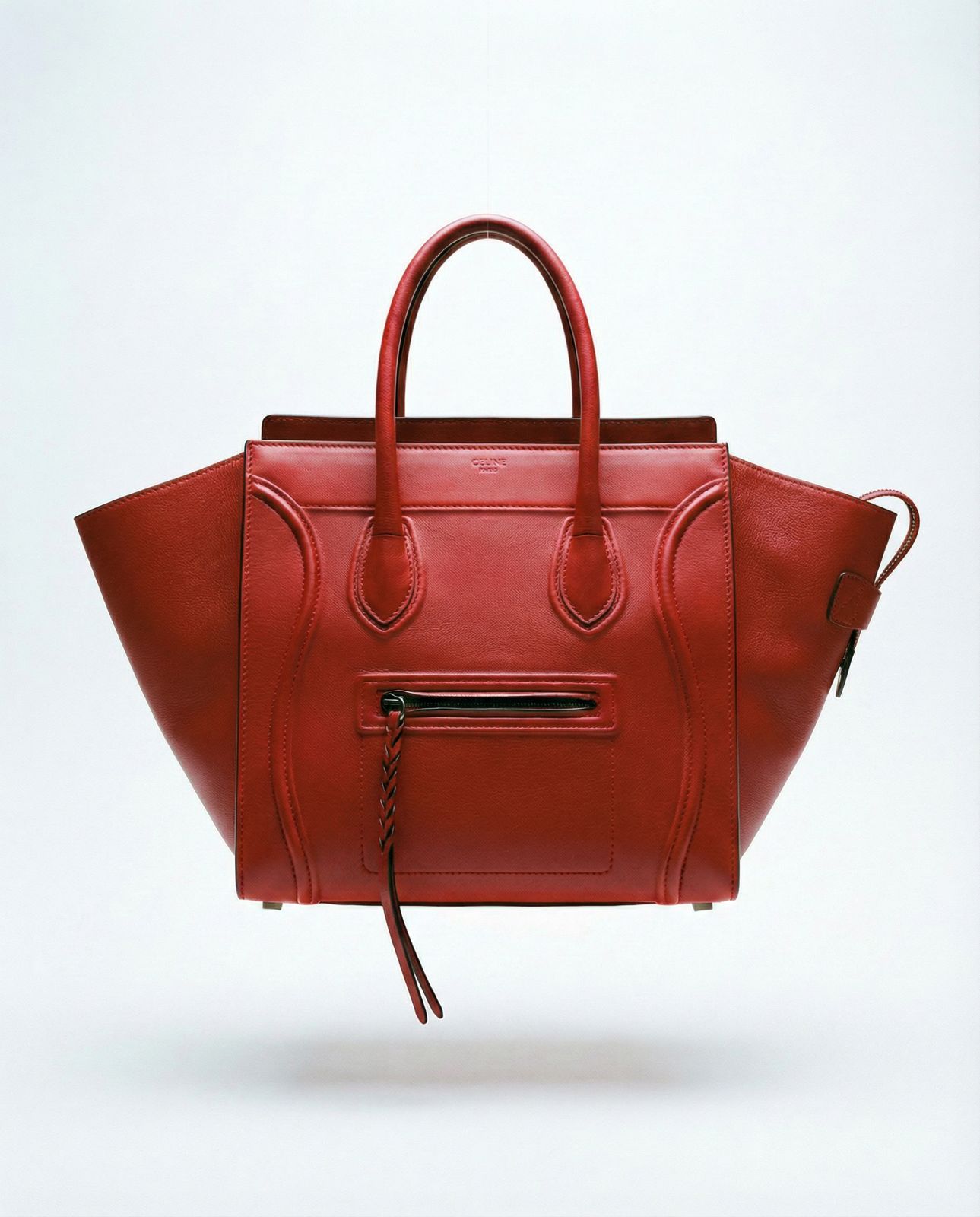 Red Céline bag with front zip pocket and structured silhouette
