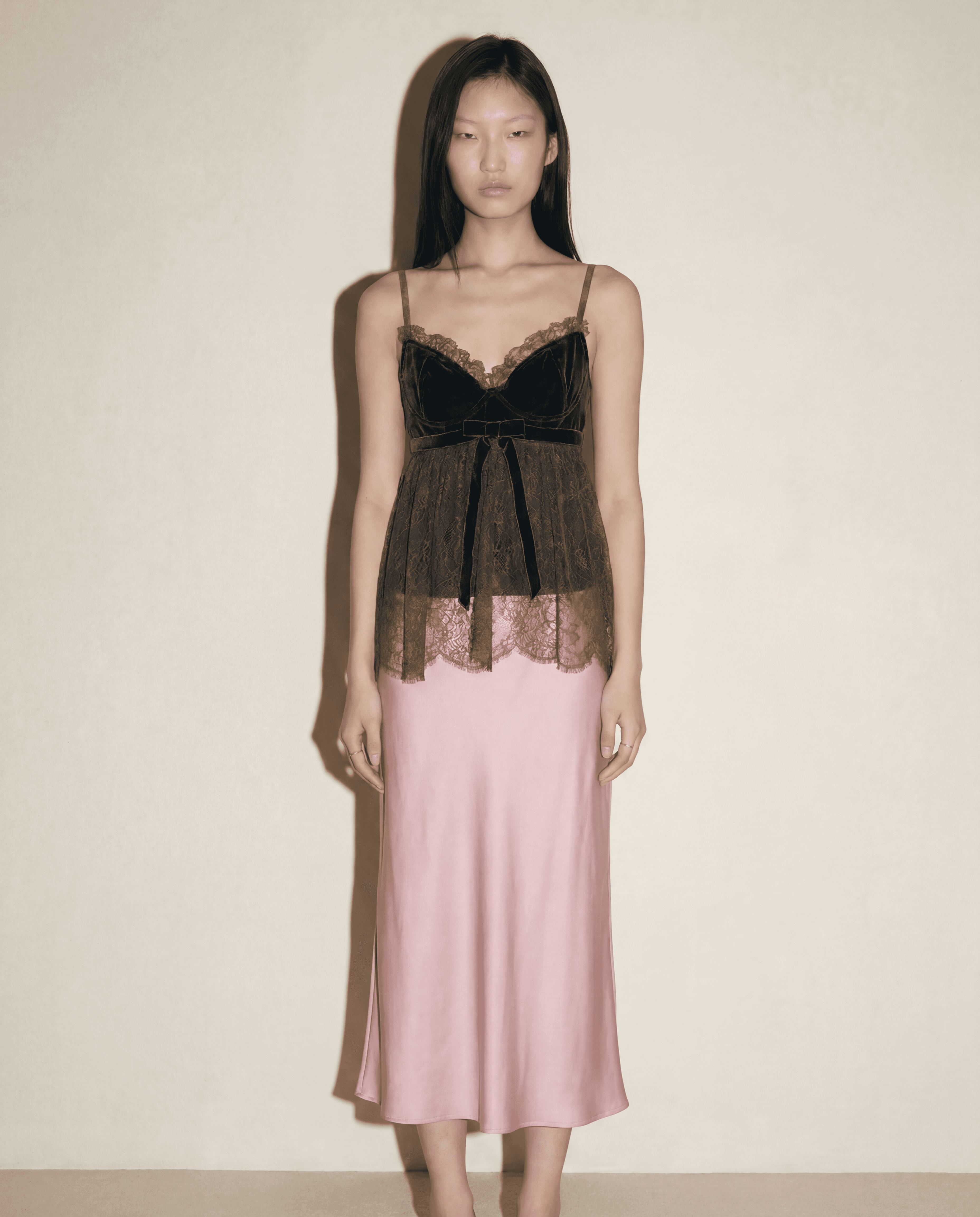 Full-length view of Valentino velvet bustier with lace overlay
and peplum — available to buy across Europe at Mezzanotte