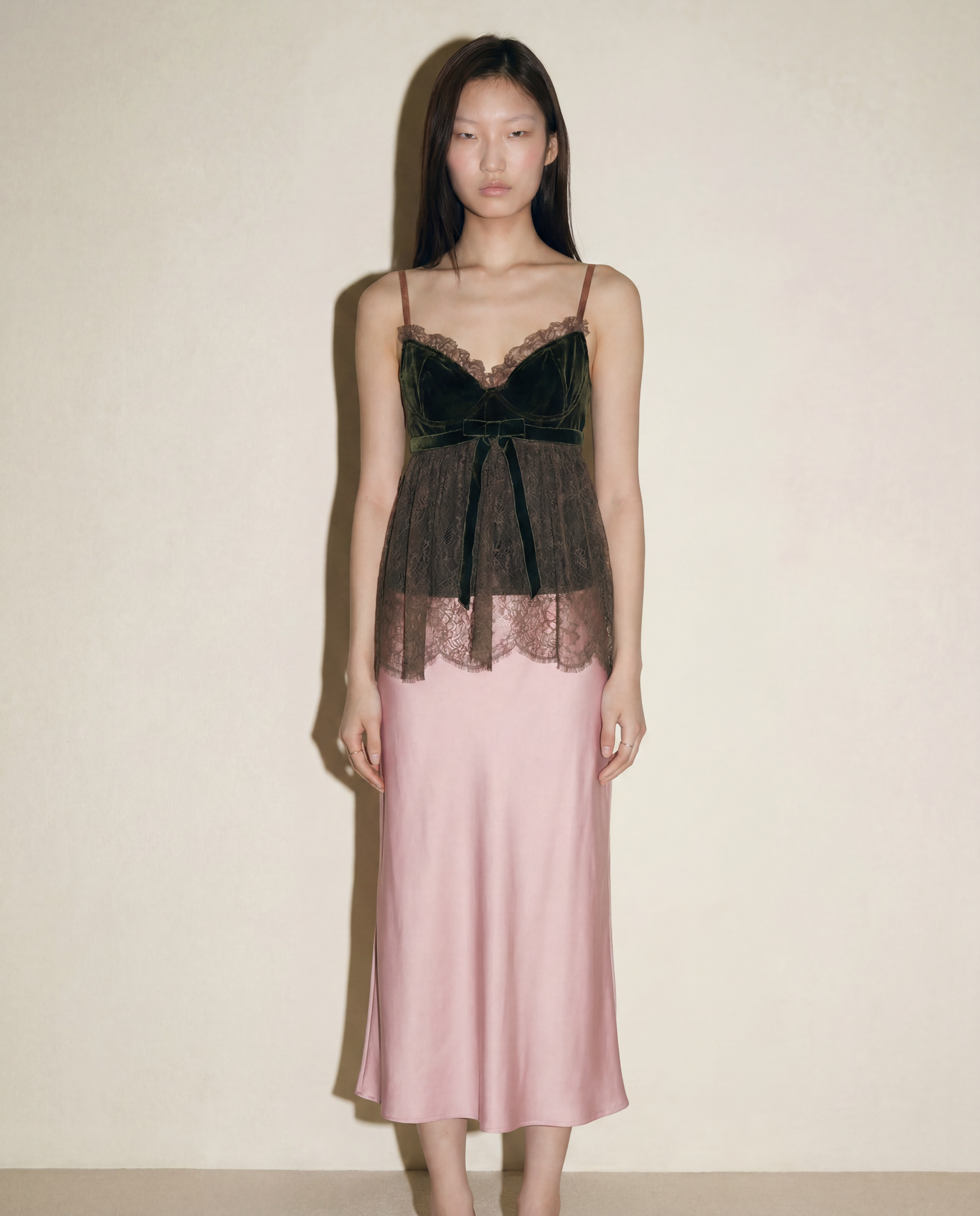 Full-length view of Valentino velvet bustier with lace overlay
and peplum — available to buy across Europe at Mezzanotte