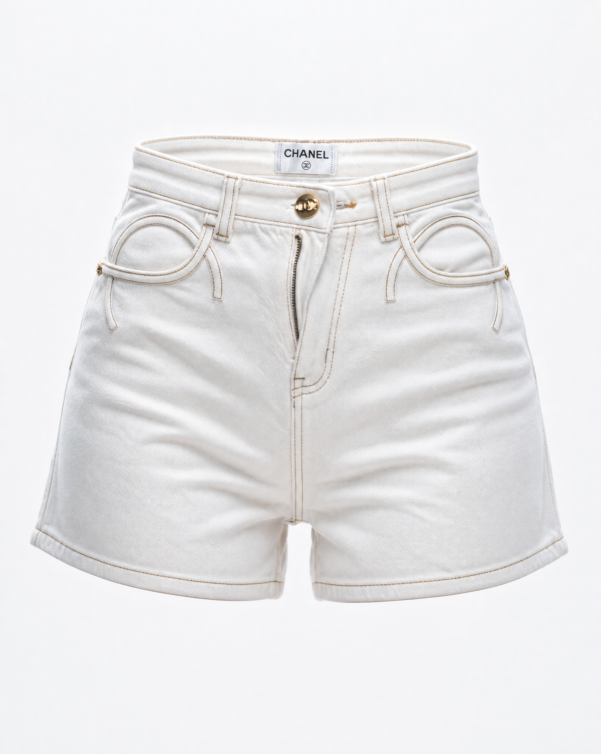 Close-up of the signature interlocking pocket design and gold-tone button on Chanel white denim shorts.