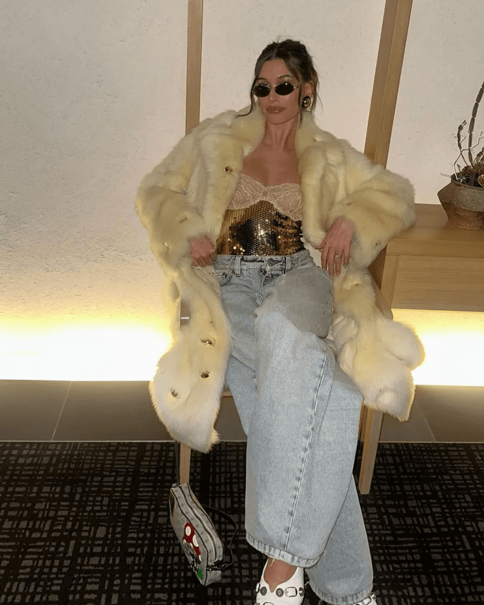 Hailey Bieber wearing our gold sequin texture and lace trim on archival Dolce & Gabbana corset curated by Mezzanotte.