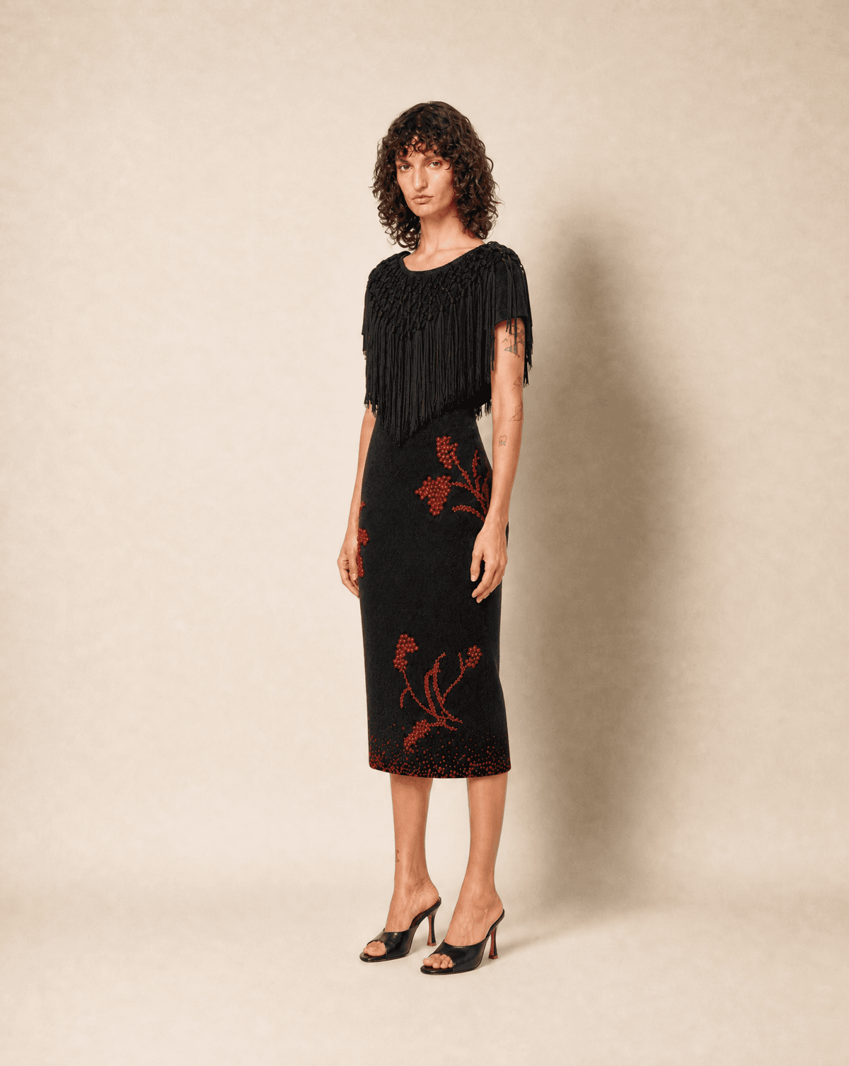 Full-length view of an archival Dolce & Gabbana fringed silk top styled on model. Rent in Madrid with Mezzanotte.