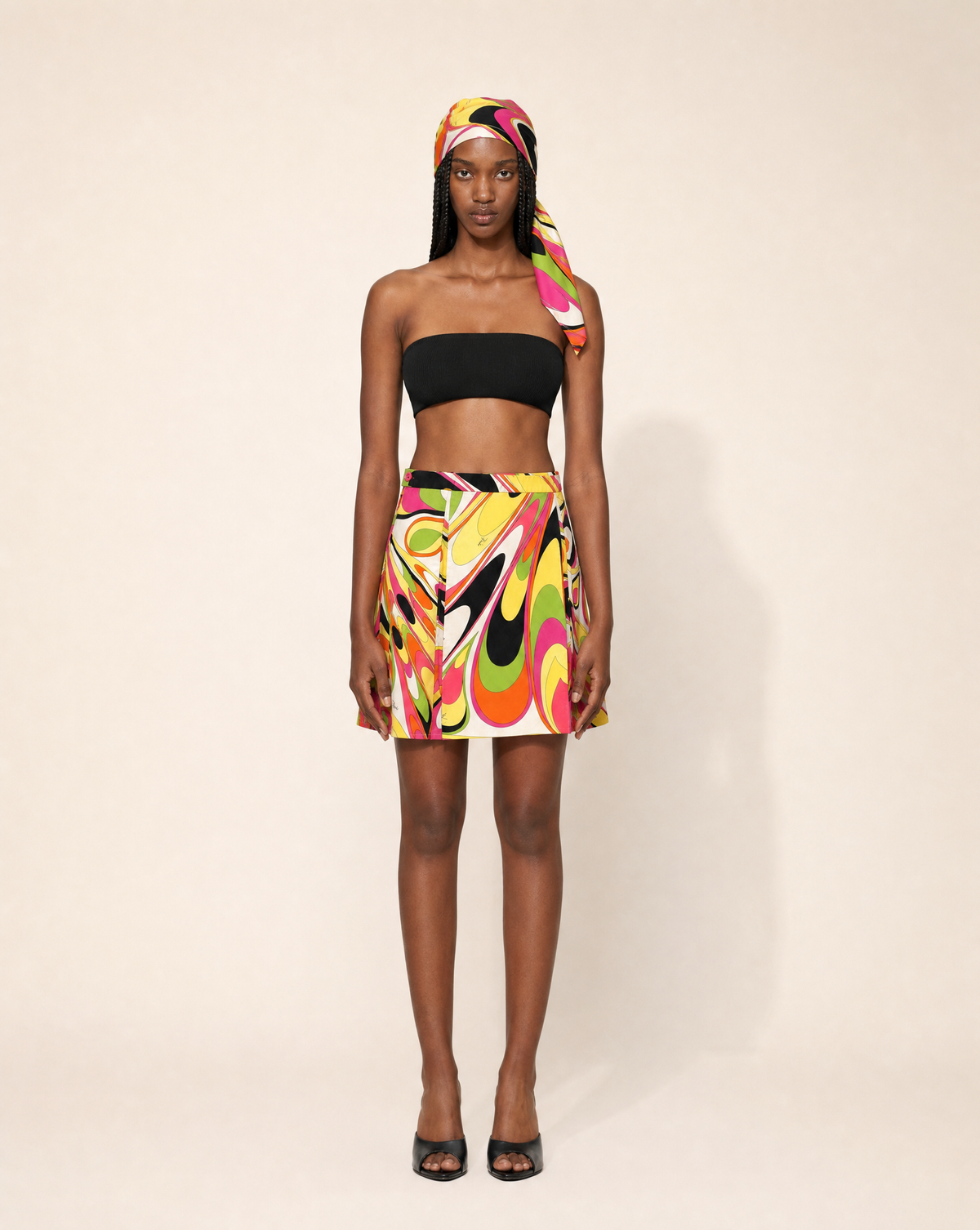 Rare Emilio Pucci 1990s geometric mini skirt with matching headscarf. Rent in Madrid or buy across Europe at Mezzanotte.