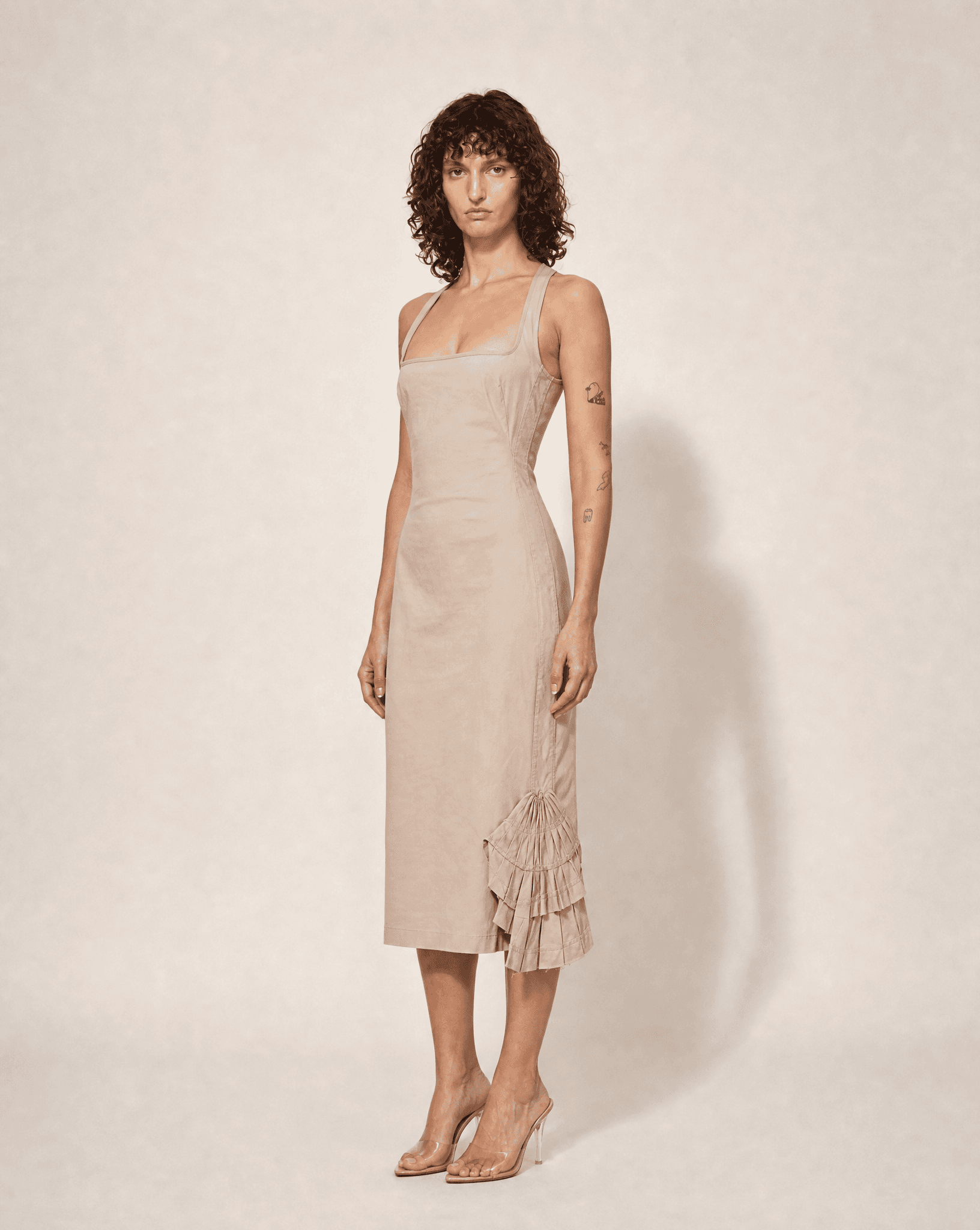 Side view of the Runway Gucci by Tom Ford Fall Winter 2003 champagne silk slip dress with side vents.