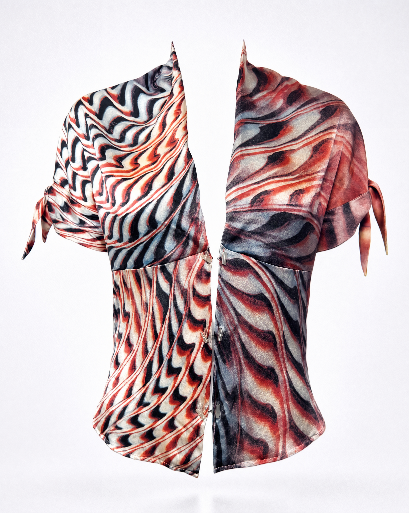 Close-up of the sculptural scarf collar and asymmetric fastening on a rare vintage Roberto Cavalli sheer silk shirt.