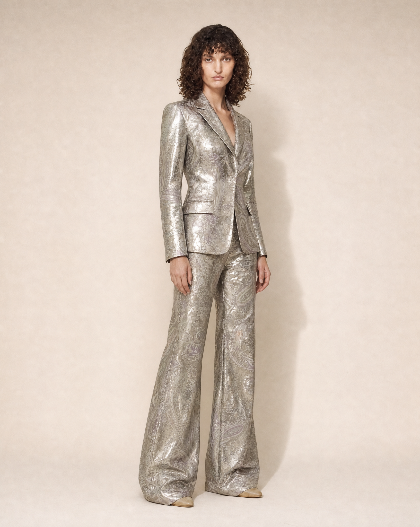 Close-up of the metallic paisley jacquard fabric and tailored blazer by Thierry Mugler.