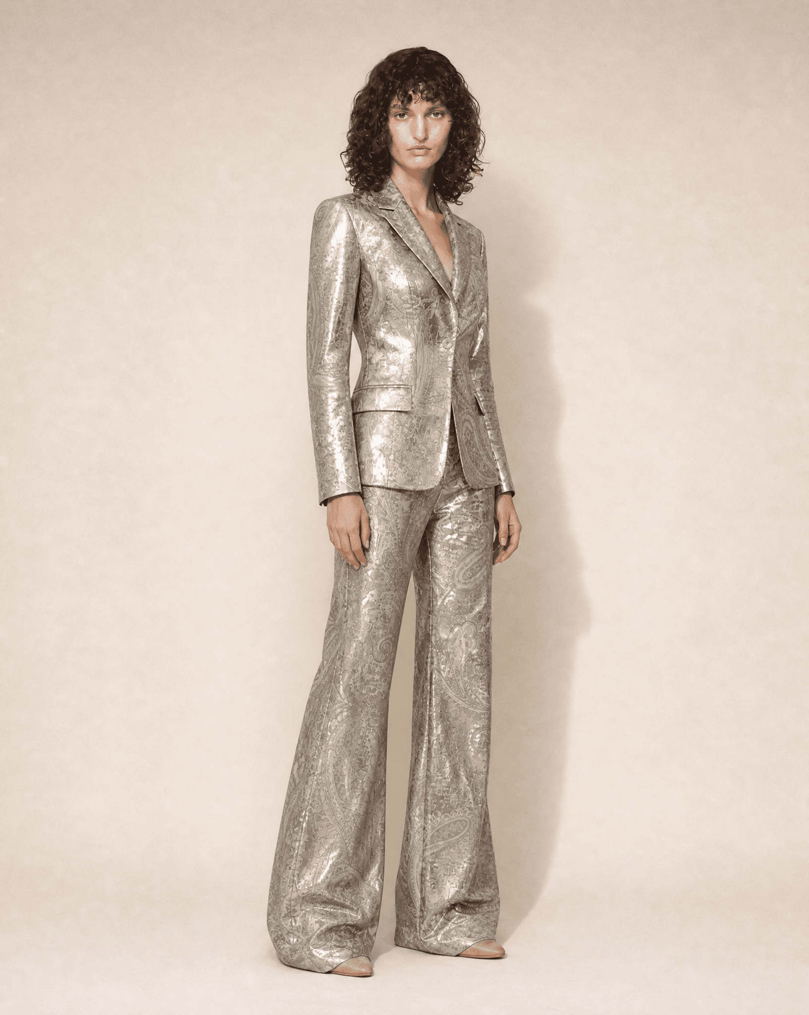 Close-up of the metallic paisley jacquard fabric and tailored blazer by Thierry Mugler.