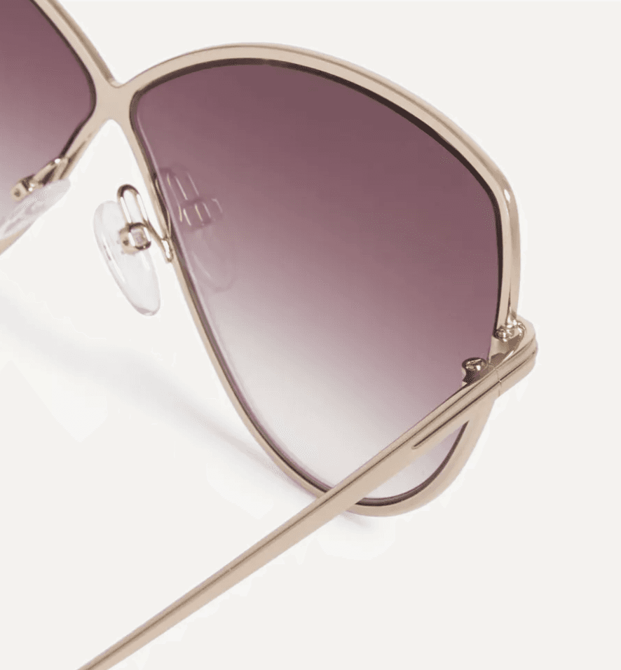 Close-up detail of the metal butterfly frame and pink gradient lenses of the 2026 Tom Ford Elise-02.