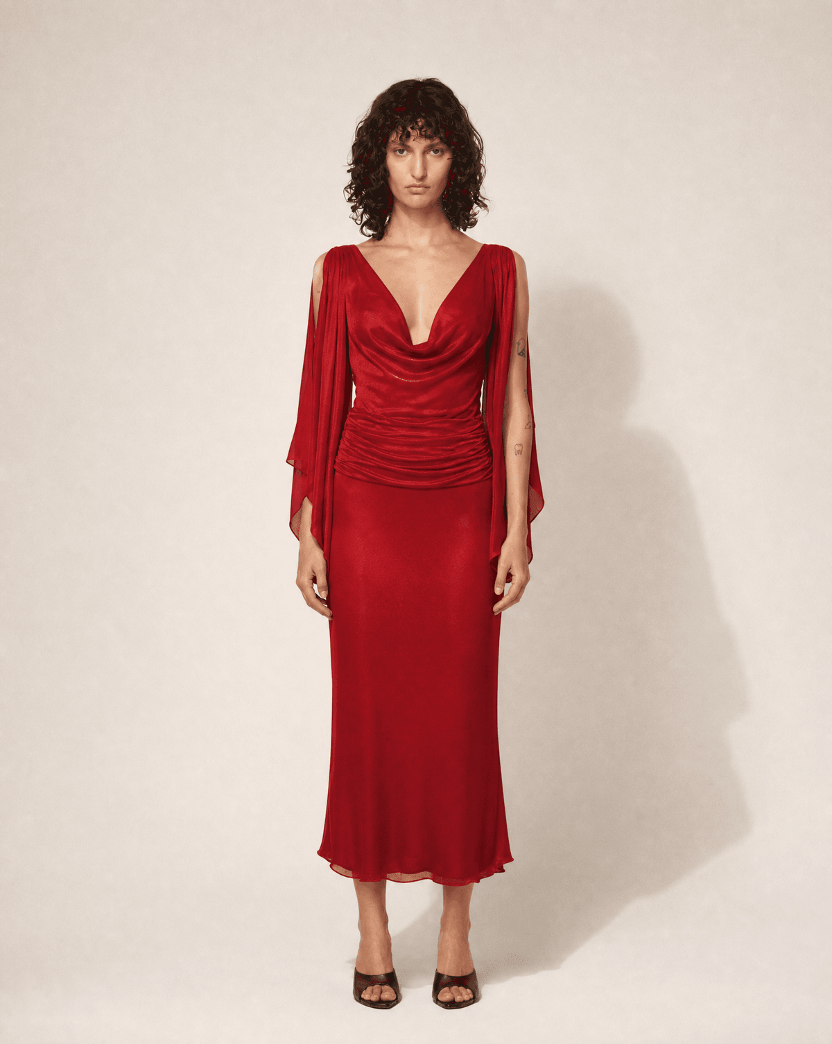 Archival Valentino Garavani 1990s Valentino Red silk chiffon gown styled on model. Rent in Madrid or buy across Europe at Mezzanotte.