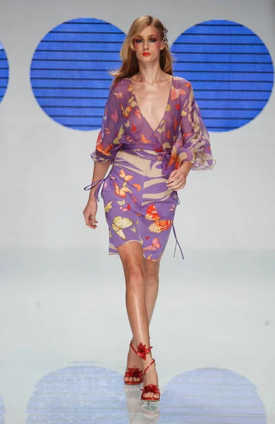 Valentino Spring Summer 2004 runway look featuring the iconic lilac butterfly print by Maria Grazia Chiuri and Pierpaolo Piccioli.