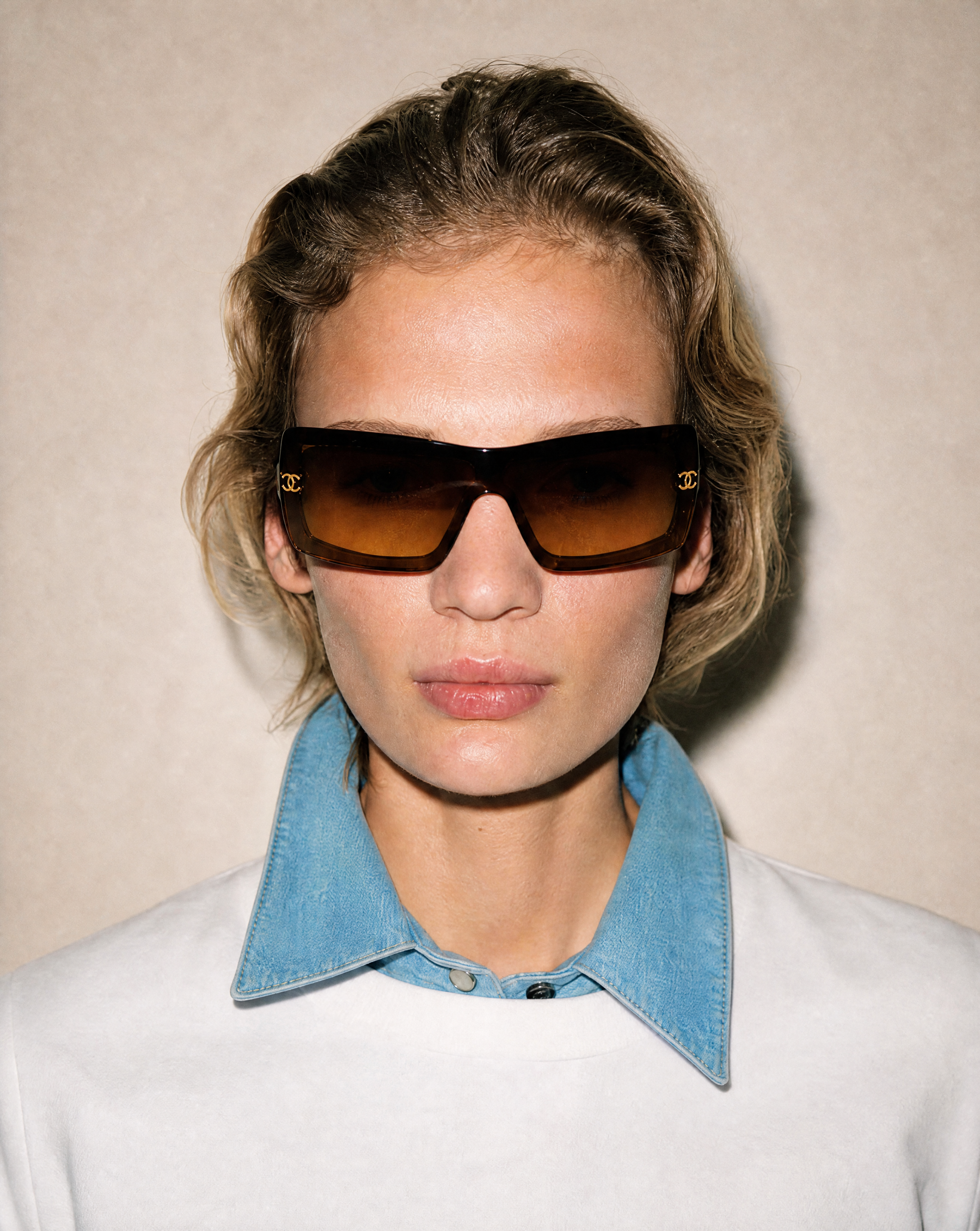 Vintage Chanel CC logo shield sunglasses with brown gradient lenses and tortoiseshell frame, available for purchase across Europe from Mezzanotte.