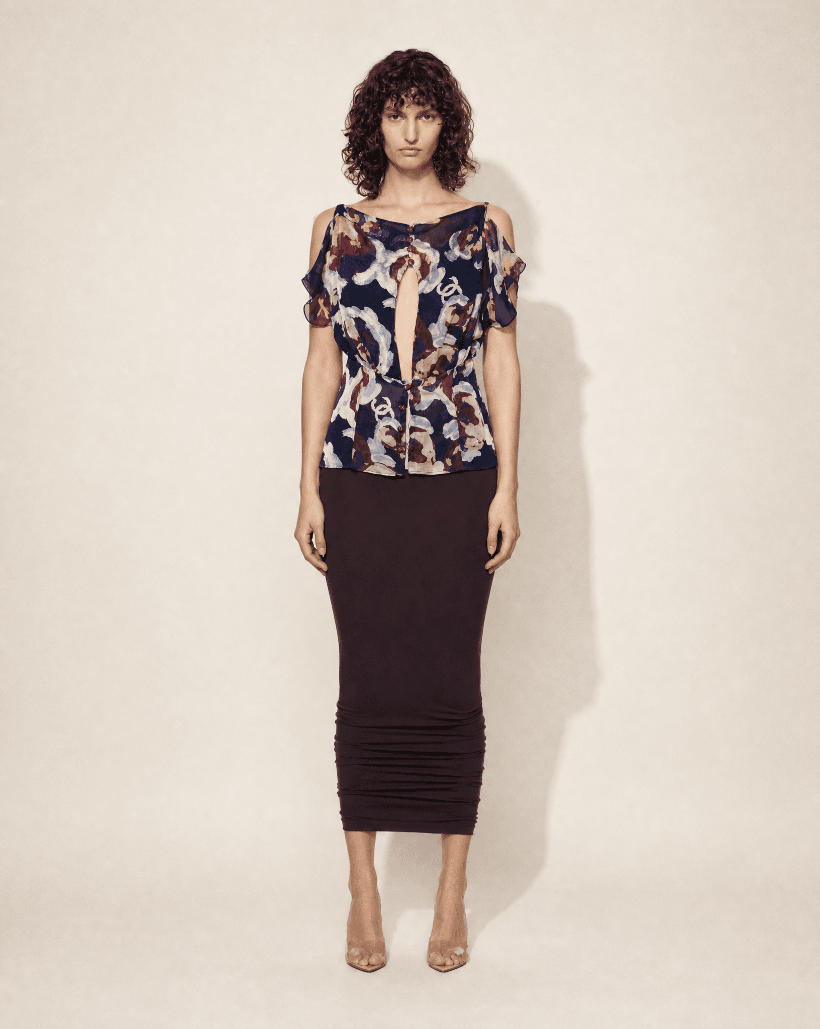Vintage Chanel silk chiffon floral blouse with subtle CC print, keyhole neckline and cold-shoulder sleeves, available for purchase across Europe from Mezzanotte.