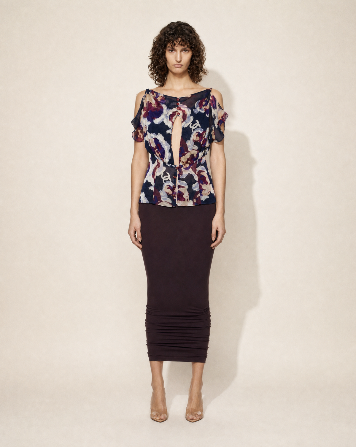 Vintage Chanel silk chiffon floral blouse with subtle CC print, keyhole neckline and cold-shoulder sleeves, available for purchase across Europe from Mezzanotte.