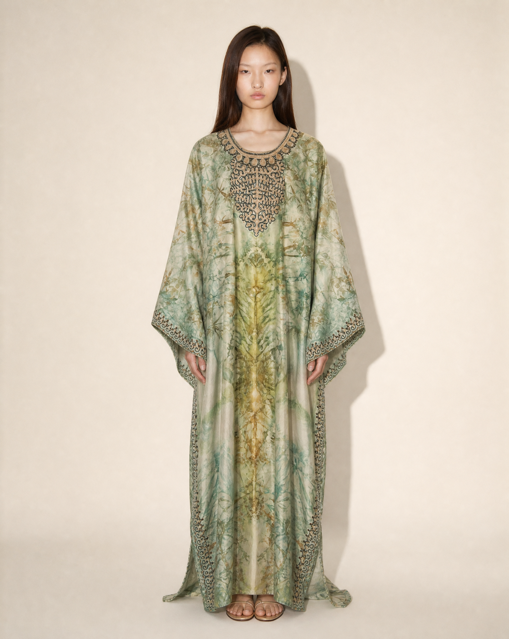 Vintage embellished silk botanical print kaftan with embroidered neckline in sage green tones, available for purchase and luxury rental across Europe from Mezzanotte.
