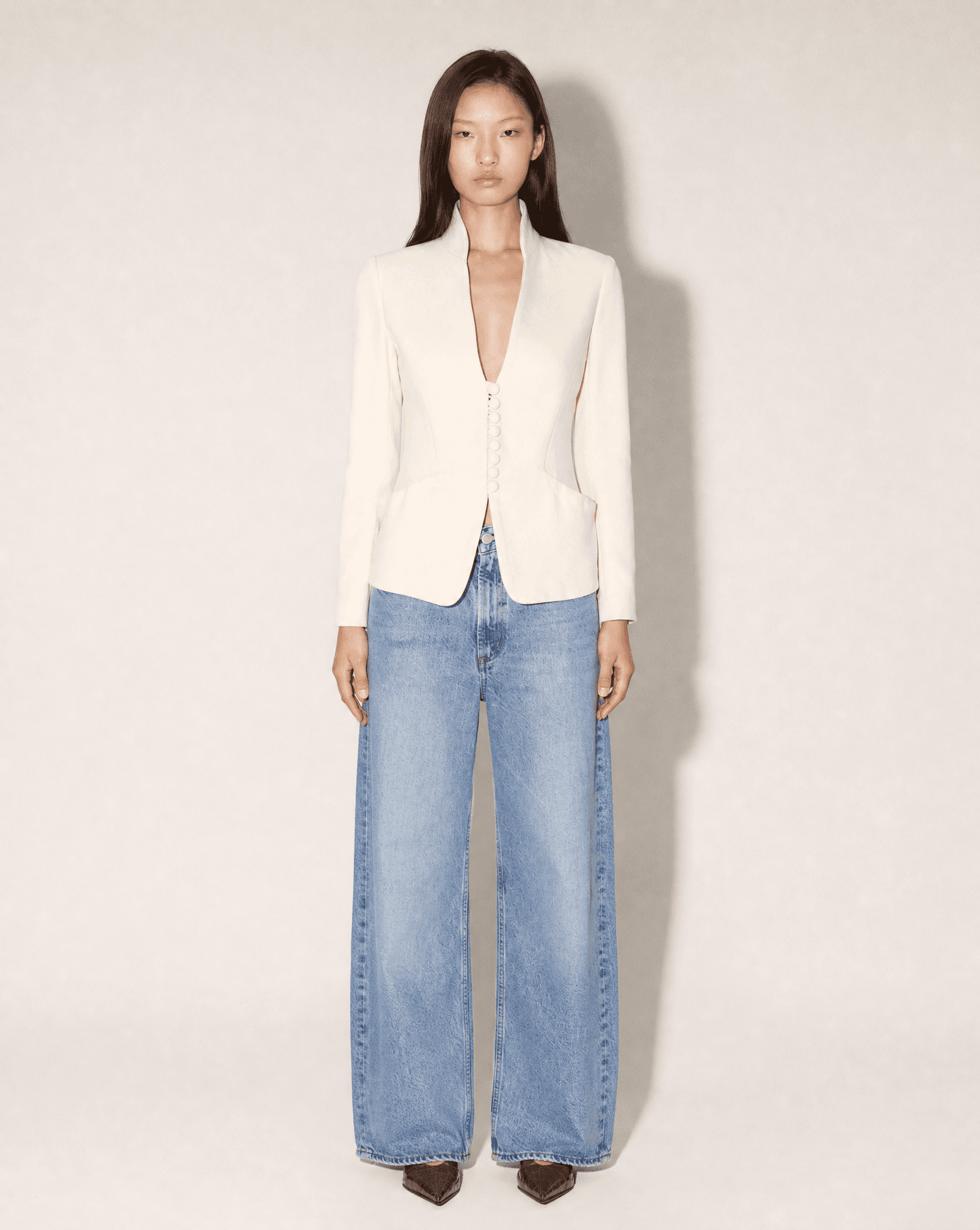 Vintage Giorgio Armani ivory stand-collar tailored blazer with fabric-covered buttons, available for purchase and luxury rental across Europe from Mezzanotte.